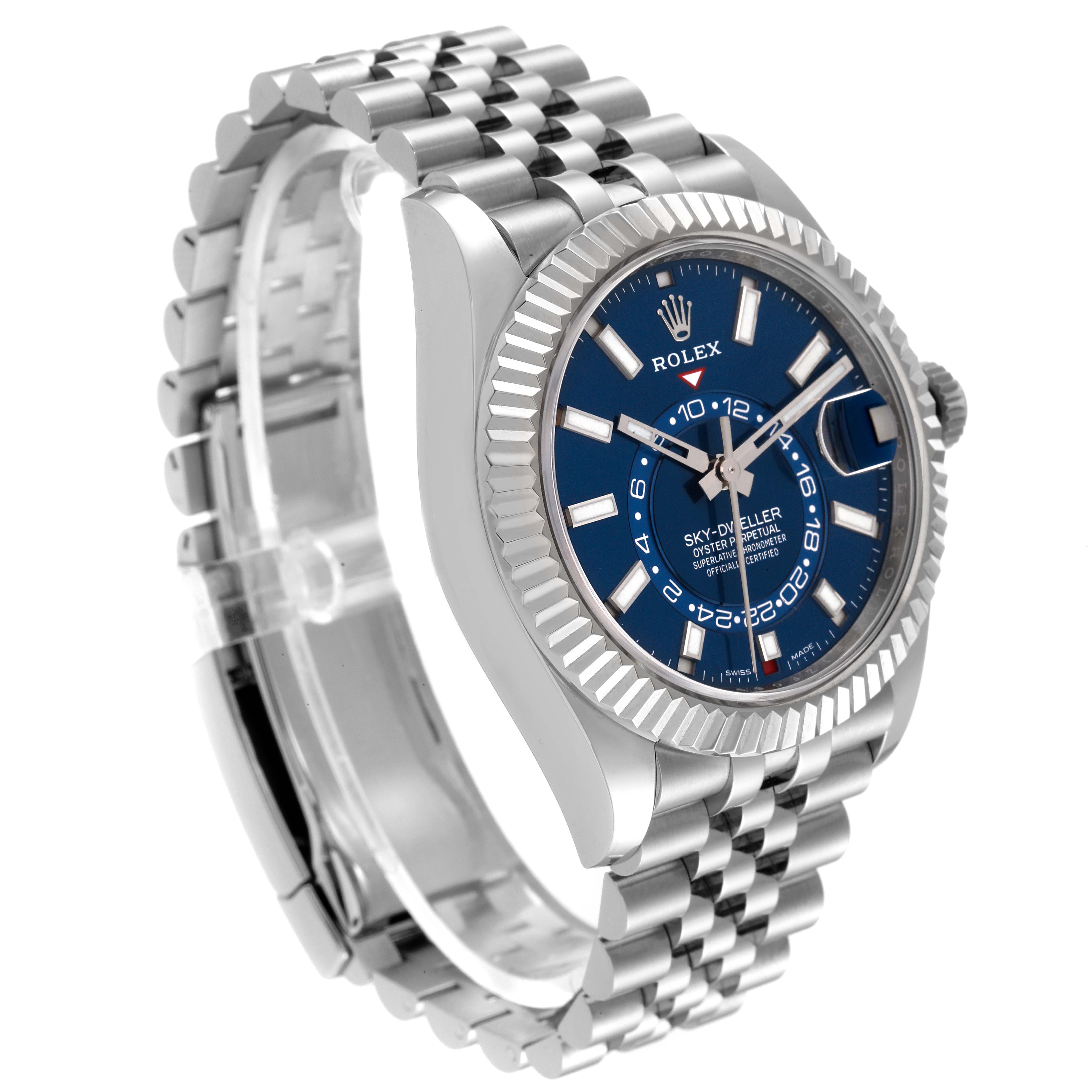 The image displays a Rolex Sky-Dweller 326934 Men's Stainless Steel Blue Dial 326934 Men's Stainless Steel Blue Dial watch from a three-quarter angle, showcasing the face, bezel, crown, and part of the bracelet.