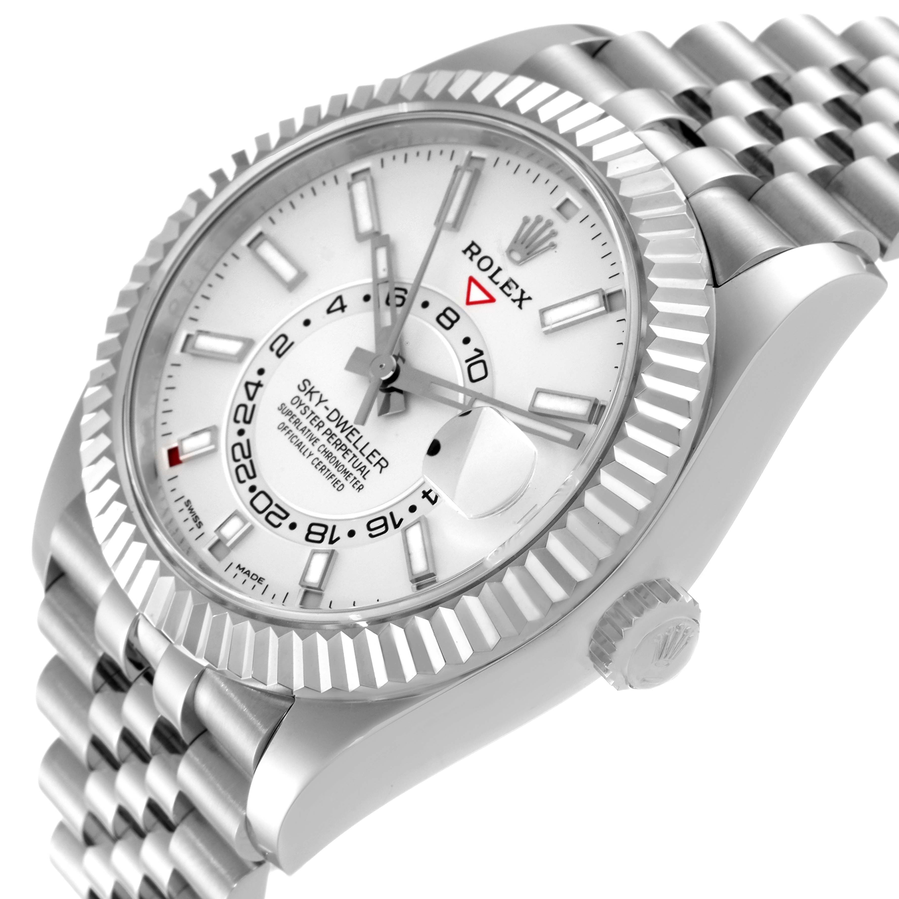 The Rolex Sky-Dweller 326934 Men's Stainless Steel White Dial 326934 Men's Stainless Steel White Dial watch is shown at a tilted angle displaying the face, bezel, part of the crown, and band.