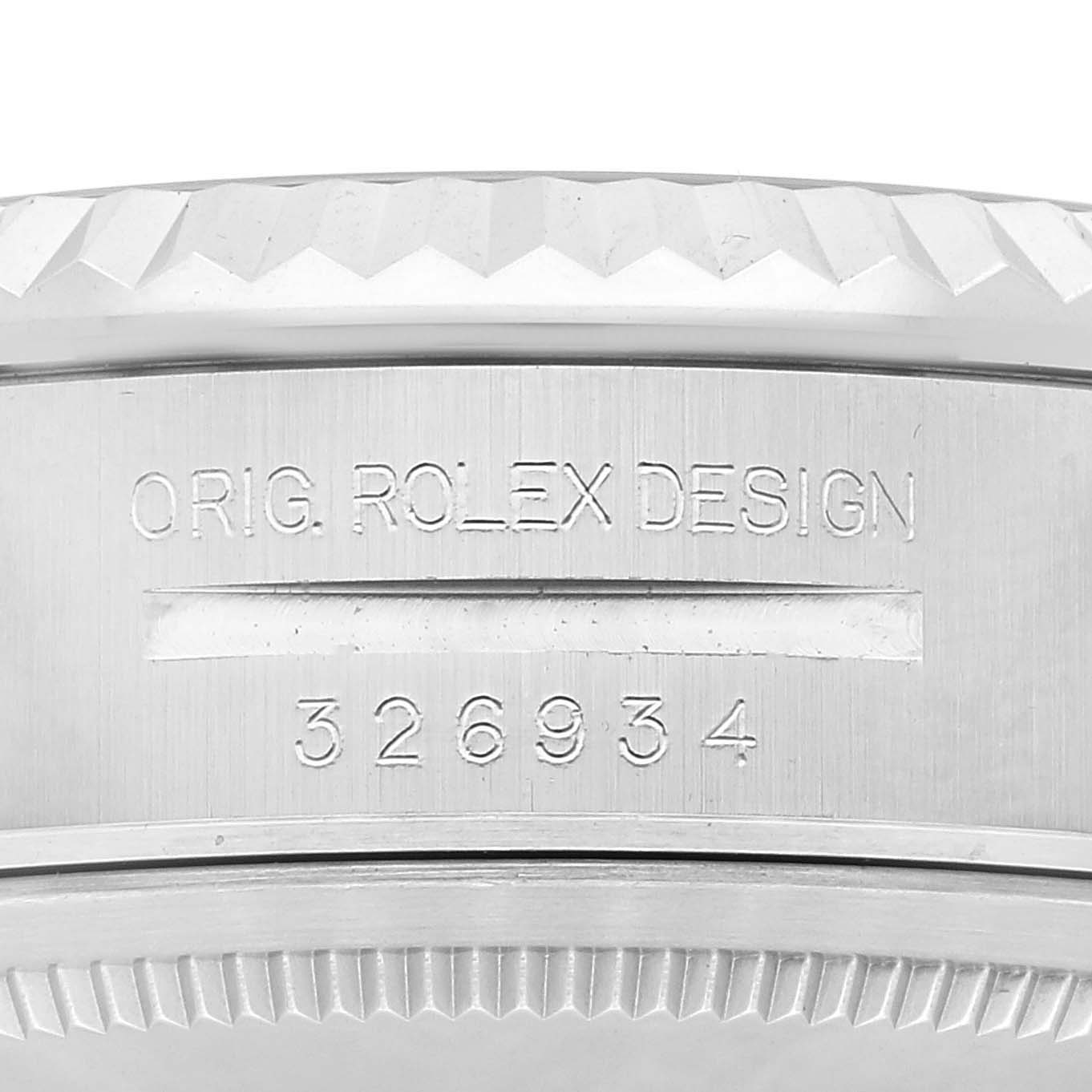 The image shows a close-up of the side of the Rolex Sky-Dweller 326934 Men's Stainless Steel White Dial 326934 Men's Stainless Steel White Dial watch case with the model number and "O.RIG. ROLEX DESIGN" engraving.