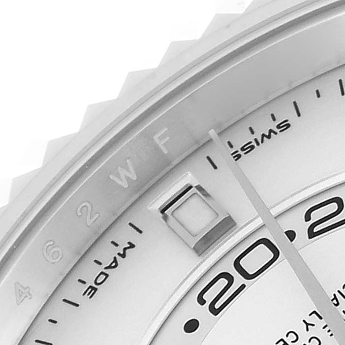 The image shows a close-up of the dial, bezel, and part of the date indicator of the Rolex Sky-Dweller 326934 Men's Stainless Steel White Dial 326934 Men's Stainless Steel White Dial watch.