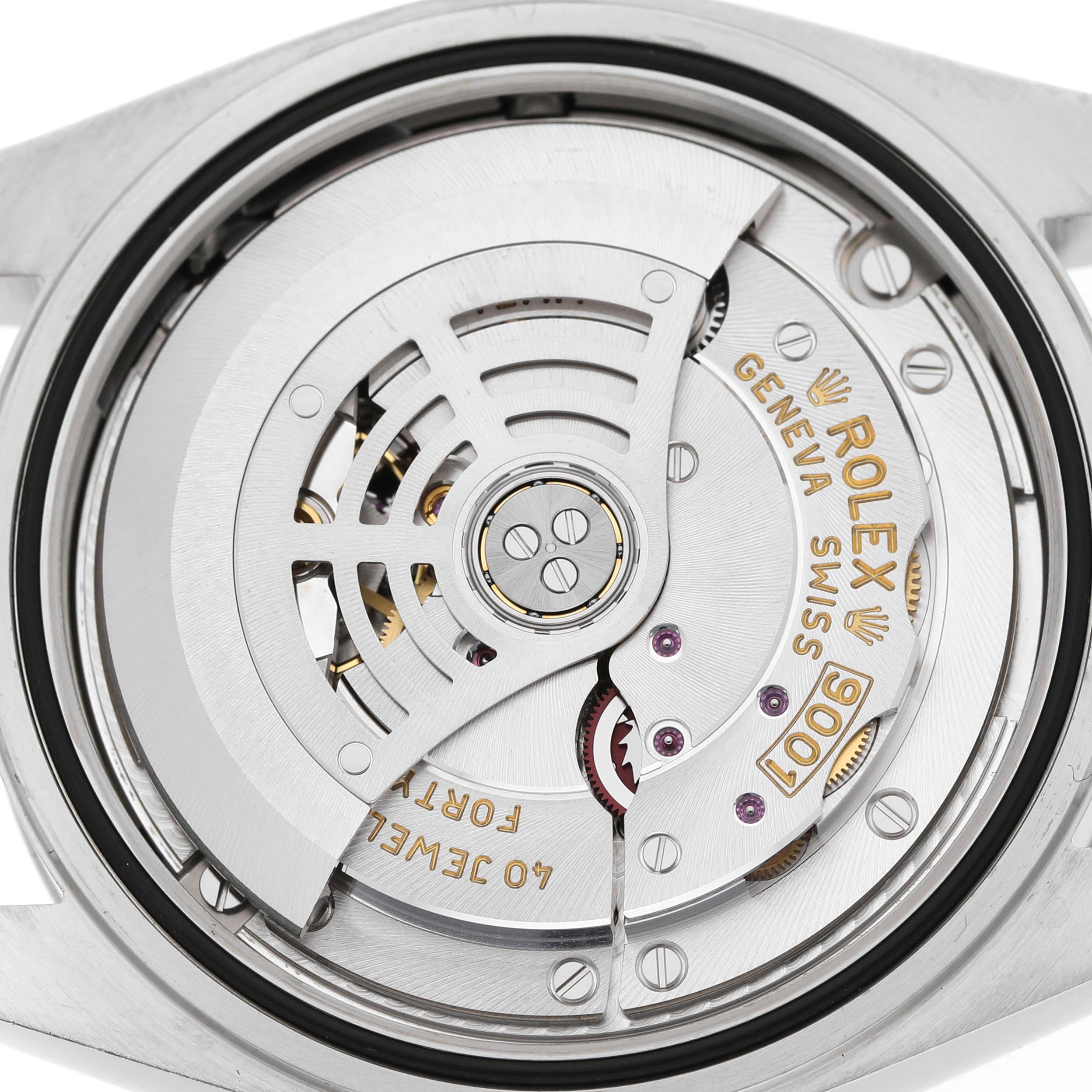 The image shows the movement of a Rolex Sky-Dweller 326934 Men's Stainless Steel Black Dial watch from a top-down angle, highlighting the rotor and intricate mechanics.
