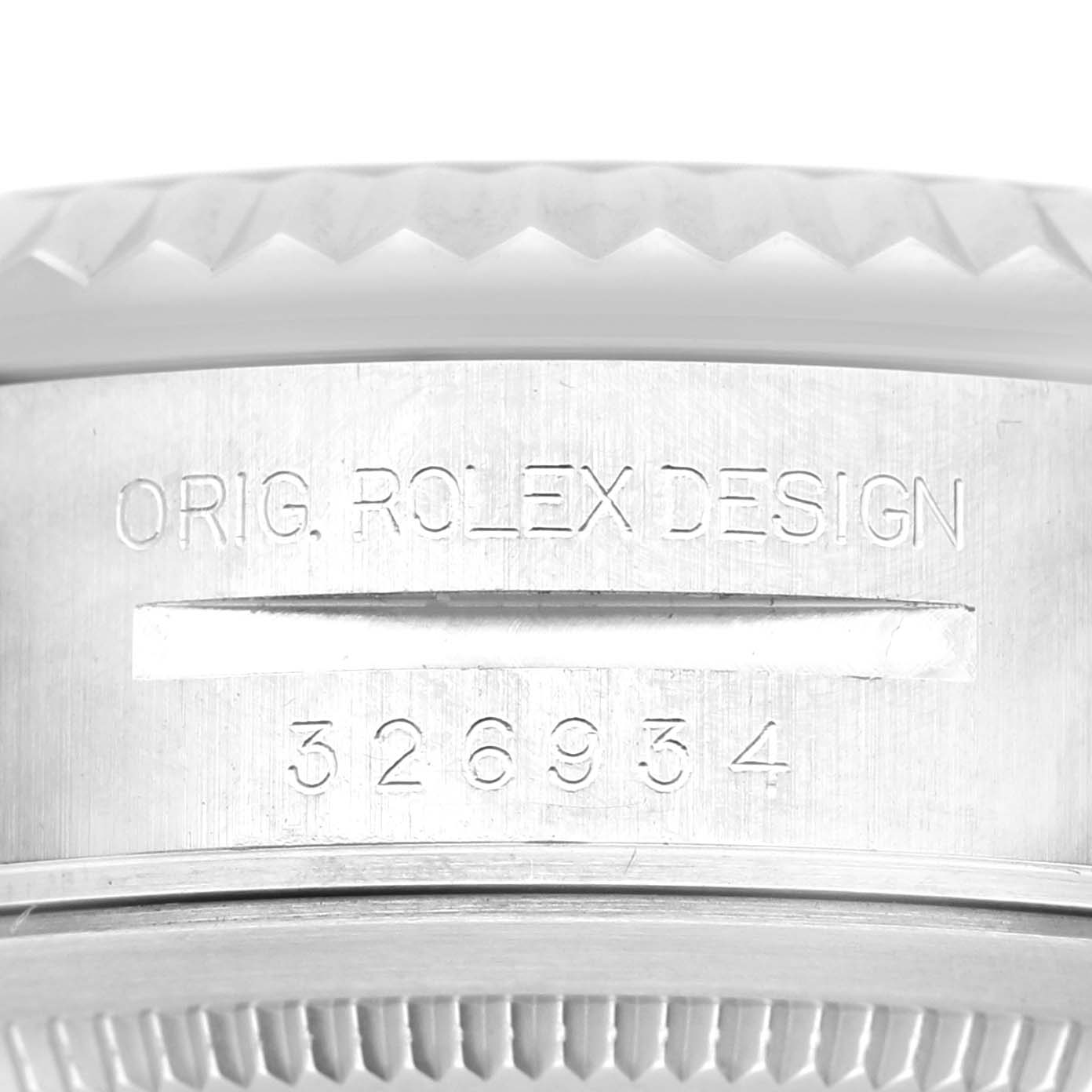 The image shows a close-up of the case side of the Rolex Sky-Dweller 326934 Men's Stainless Steel Black Dial, featuring engraved design details.