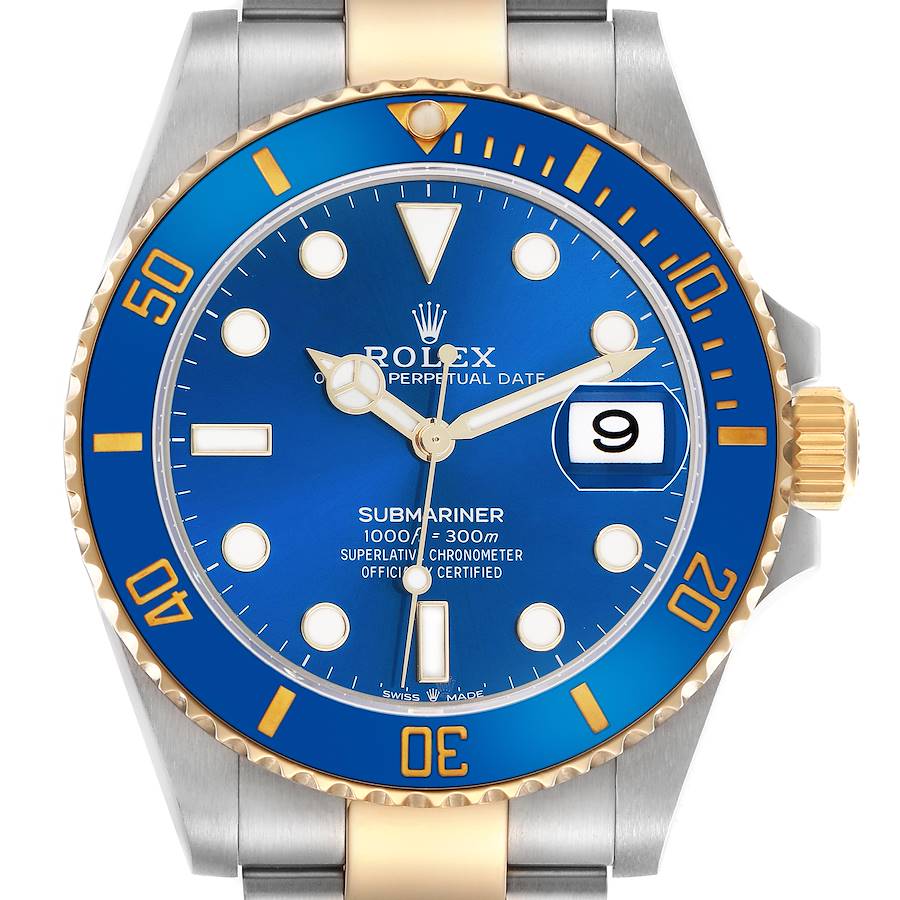 This image shows a front view of a Rolex Submariner, highlighting its blue dial, date window, and gold and silver bezel.