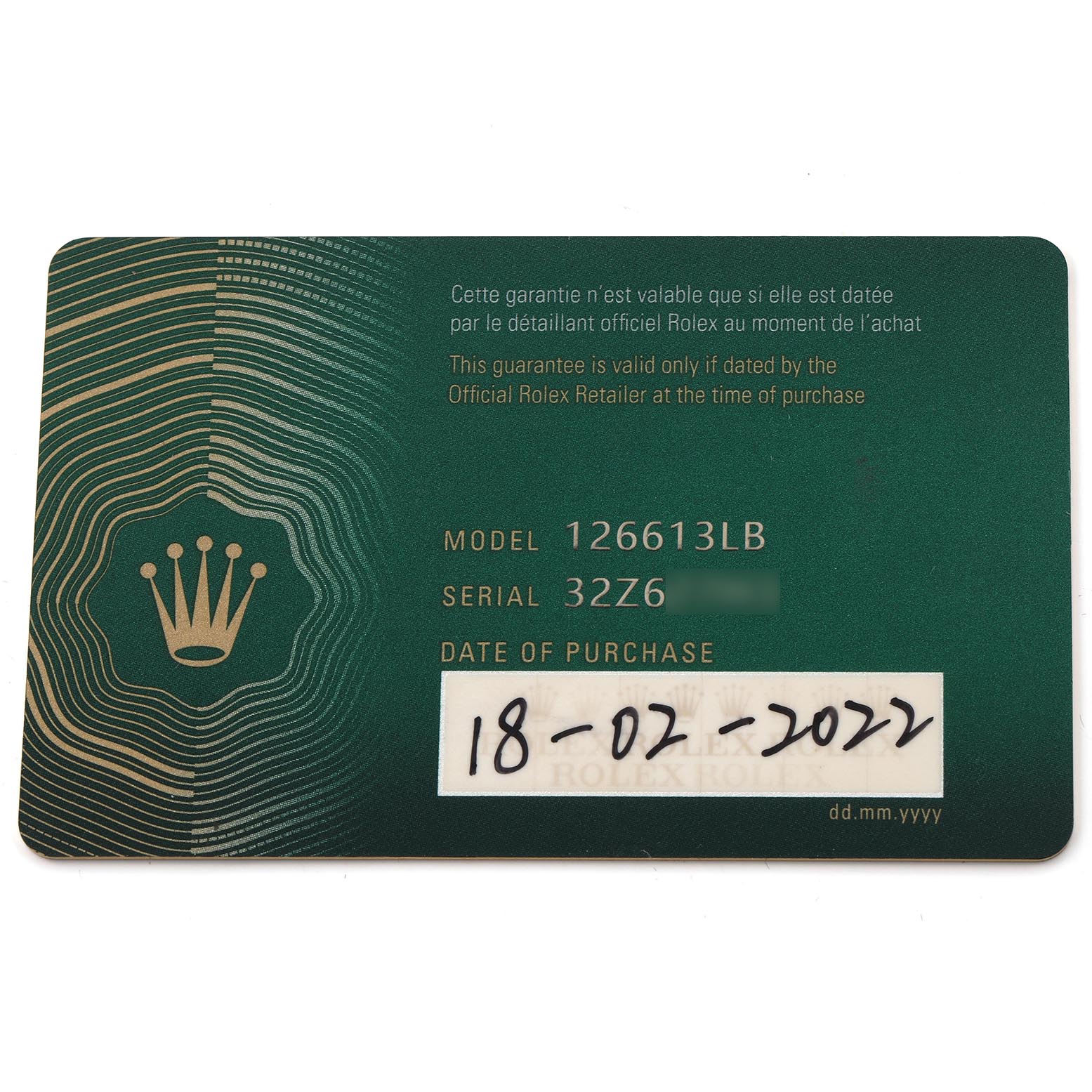 The image shows a warranty card for the Rolex Submariner 126613 Men
s Steel and Gold (two tone) Blue Dial 126613 Men
s Steel and Gold (two tone) Blue Dial model 126613LB, viewed from above.