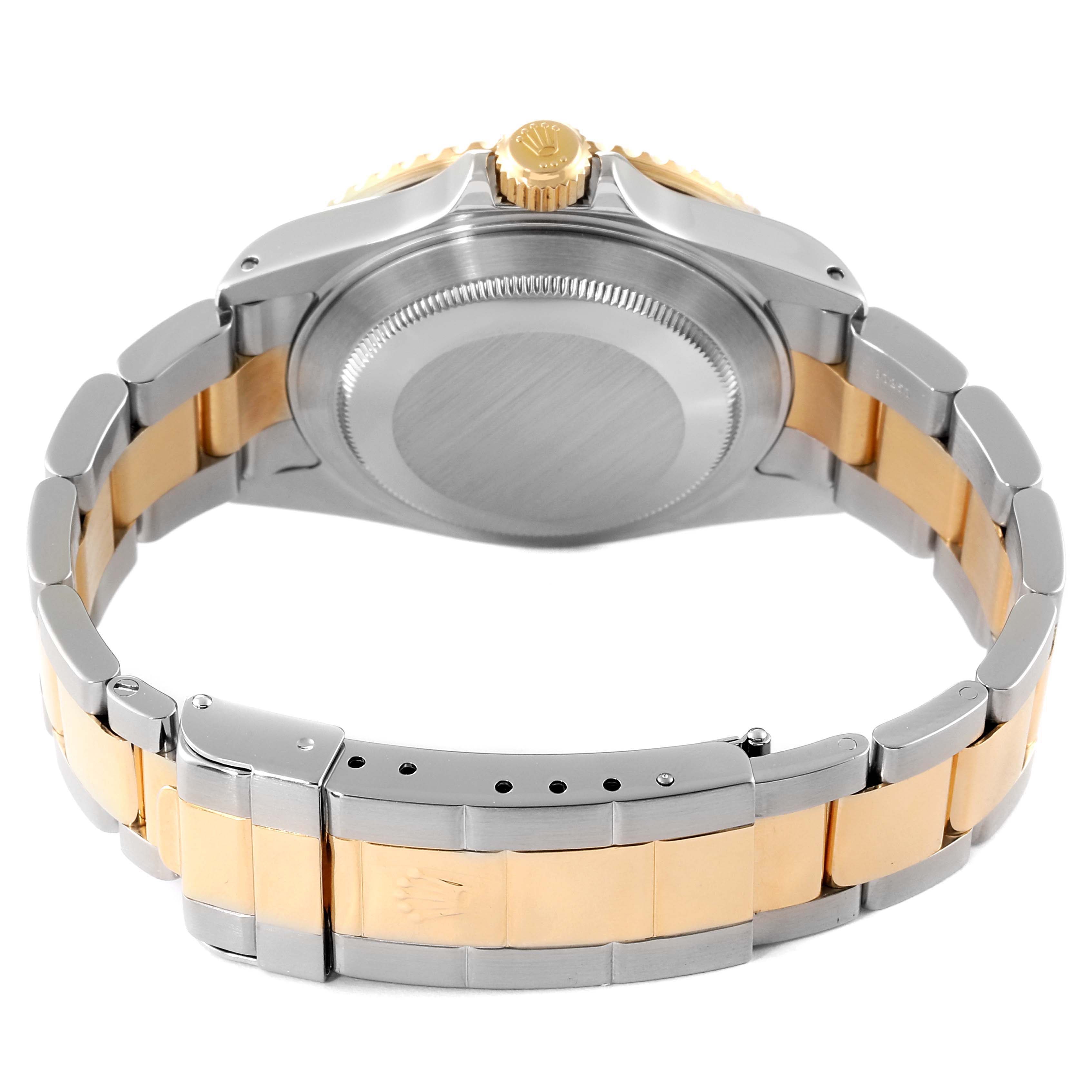 This image shows the back case and bracelet of a Rolex Submariner 16613 Men
s Steel and Gold (two tone) Blue Dial 16613 Men
s Steel and Gold (two tone) Blue Dial watch from a rear angle.