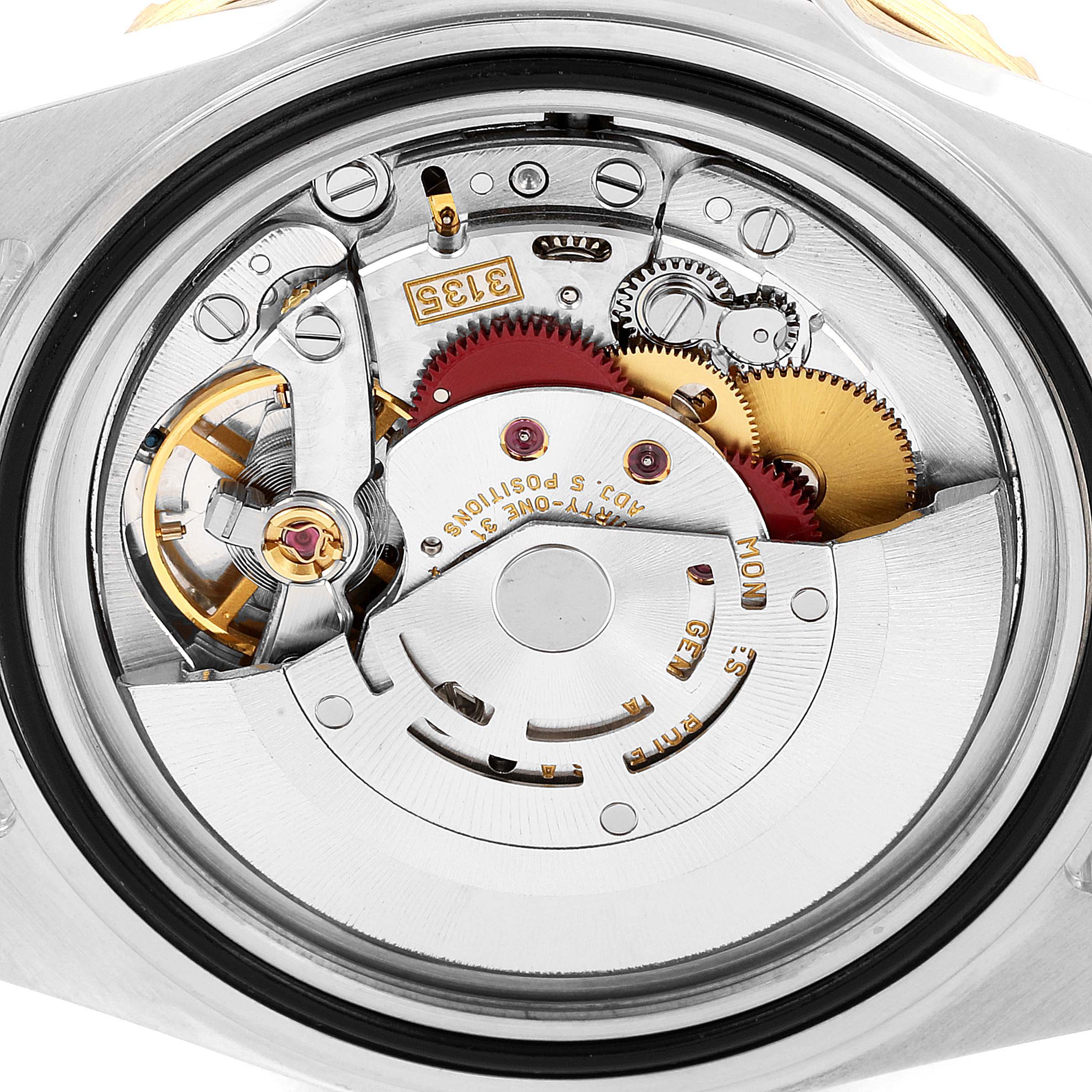 This image shows a close-up view of the movement and internal components of a Rolex Submariner 16613 Men
s Steel and Gold (two tone) Blue Dial 16613 Men
s Steel and Gold (two tone) Blue Dial watch.