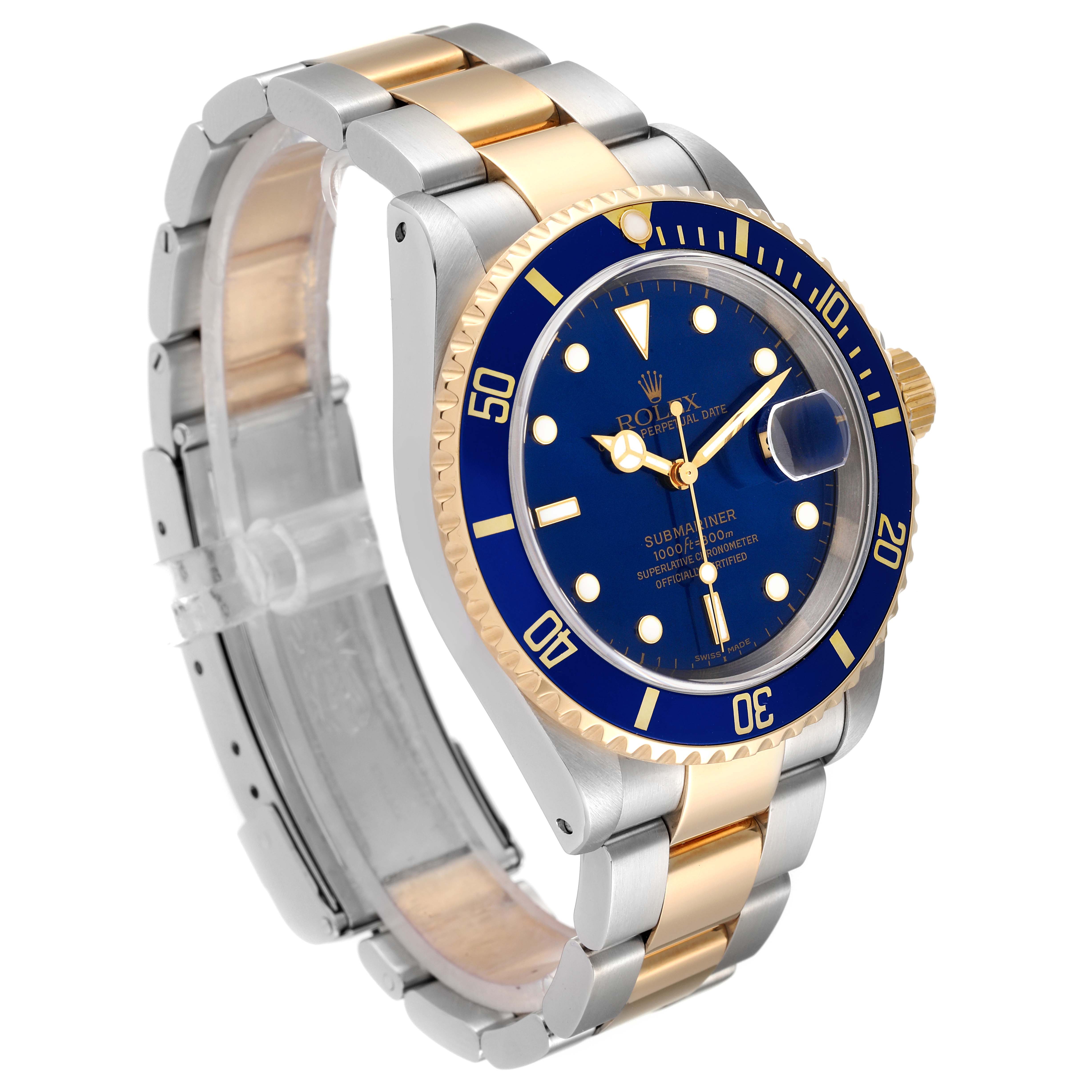 The image shows a side-angle view of a Rolex Submariner 16613 Men
s Steel and Gold (two tone) Blue Dial 16613 Men
s Steel and Gold (two tone) Blue Dial watch, featuring its two-tone bracelet, blue dial, and rotating bezel.