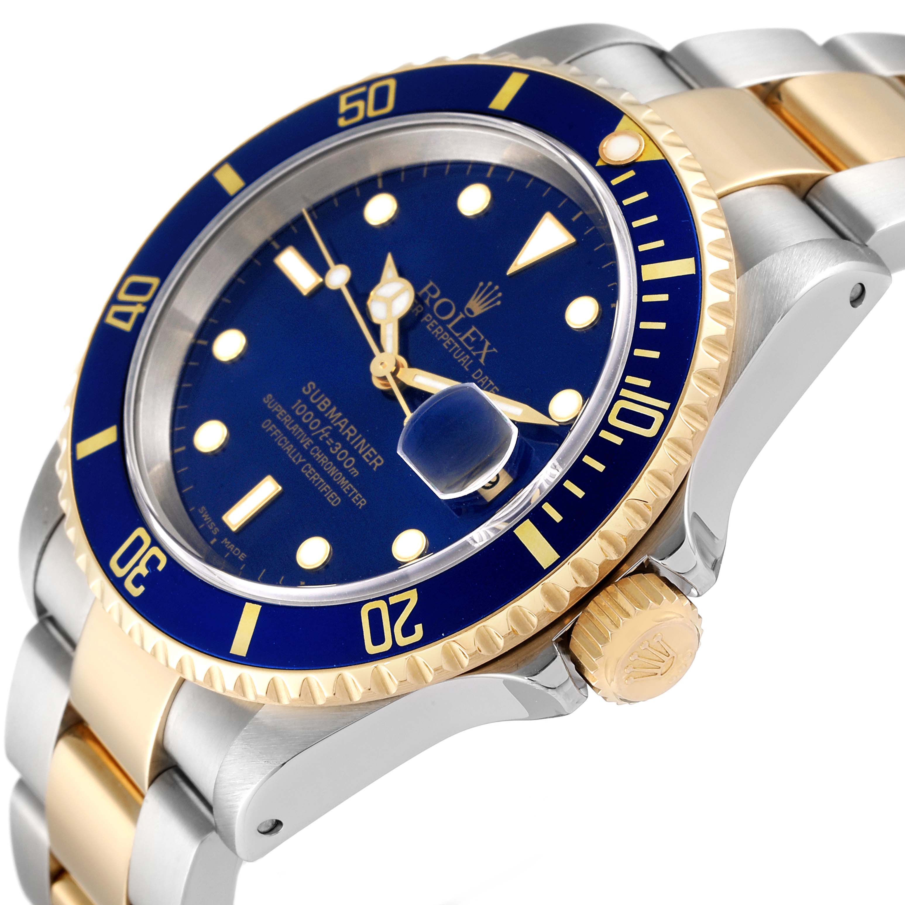 The image shows a Rolex Submariner 16613 Men
s Steel and Gold (two tone) Blue Dial 16613 Men
s Steel and Gold (two tone) Blue Dial watch at an angle highlighting its blue dial, bezel, crown, and two-tone bracelet.