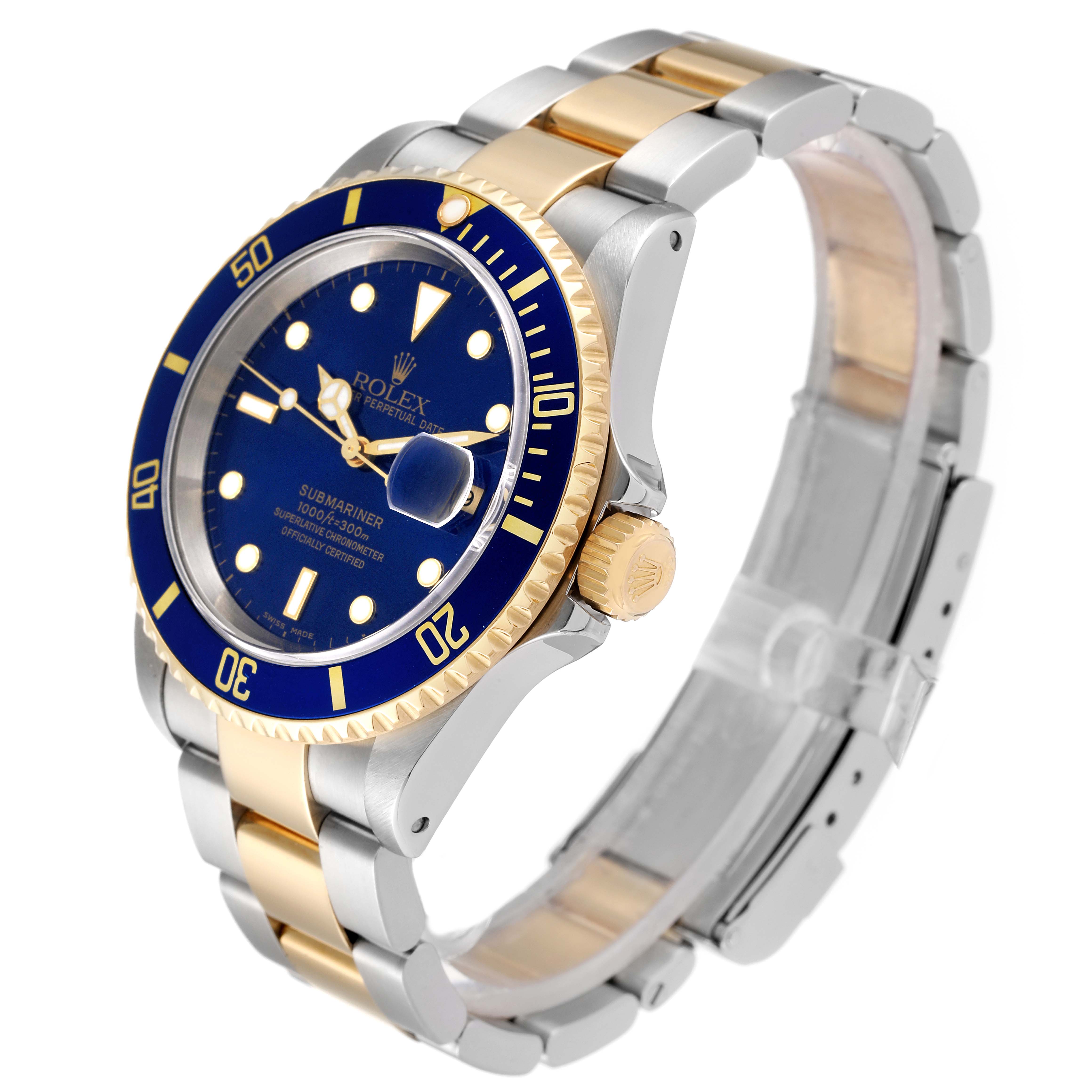 This image shows a Rolex Submariner 16613 Men
s Steel and Gold (two tone) Blue Dial 16613 Men
s Steel and Gold (two tone) Blue Dial watch at a three-quarter front angle, highlighting the blue dial, bezel, and two-tone bracelet.