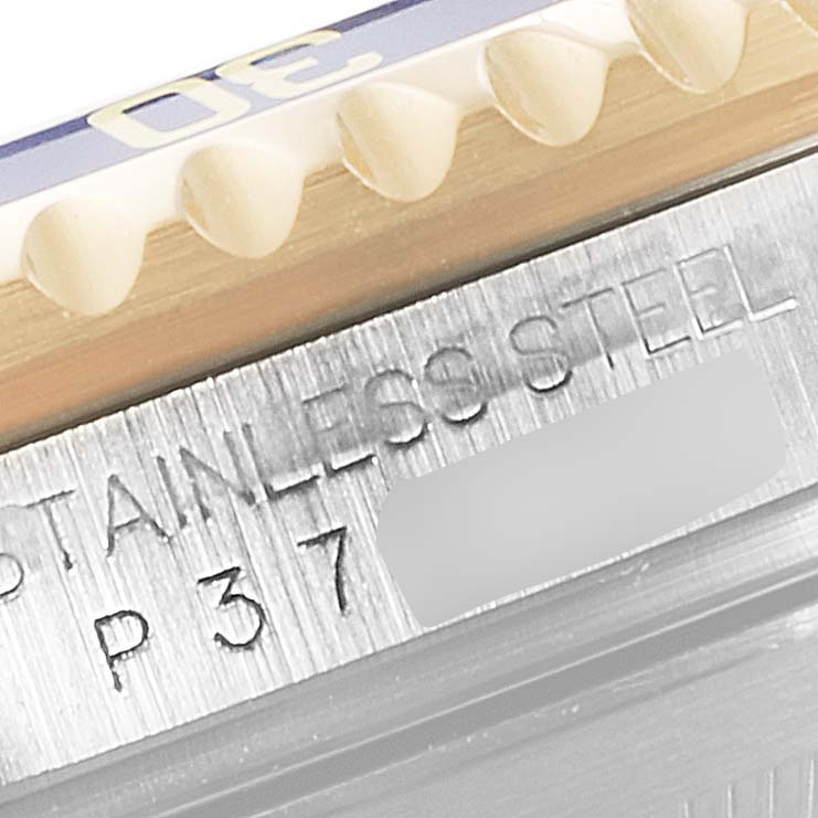 This close-up image shows part of the bezel and the engraved stainless steel case of a Rolex Submariner 16613 Men
s Steel and Gold (two tone) Blue Dial 16613 Men
s Steel and Gold (two tone) Blue Dial watch.