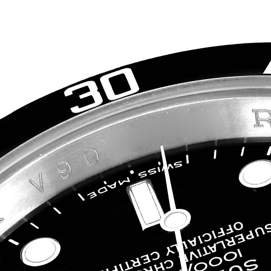 The image shows a close-up of the bezel and part of the dial of a Rolex Submariner 16610 Men's Stainless Steel Black Dial 16610 Men's Stainless Steel Black Dial watch, highlighting the 30-minute mark.