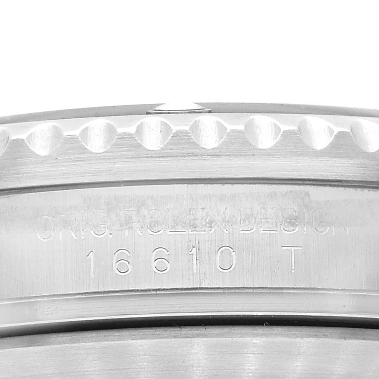 The image shows a close-up of the side engraving on the bezel and case of a Rolex Submariner 16610 Men's Stainless Steel Black Dial 16610 Men's Stainless Steel Black Dial, model number 16610T.
