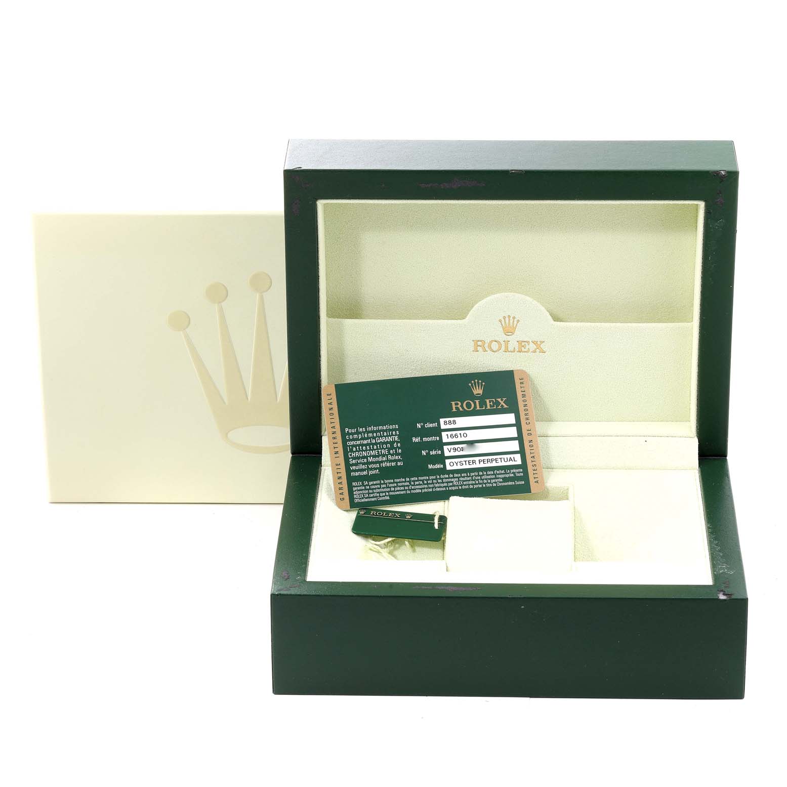 The image shows an open Rolex Submariner 16610 Men's Stainless Steel Black Dial 16610 Men's Stainless Steel Black Dial watch box with warranty card and tag, angled to display the interior.