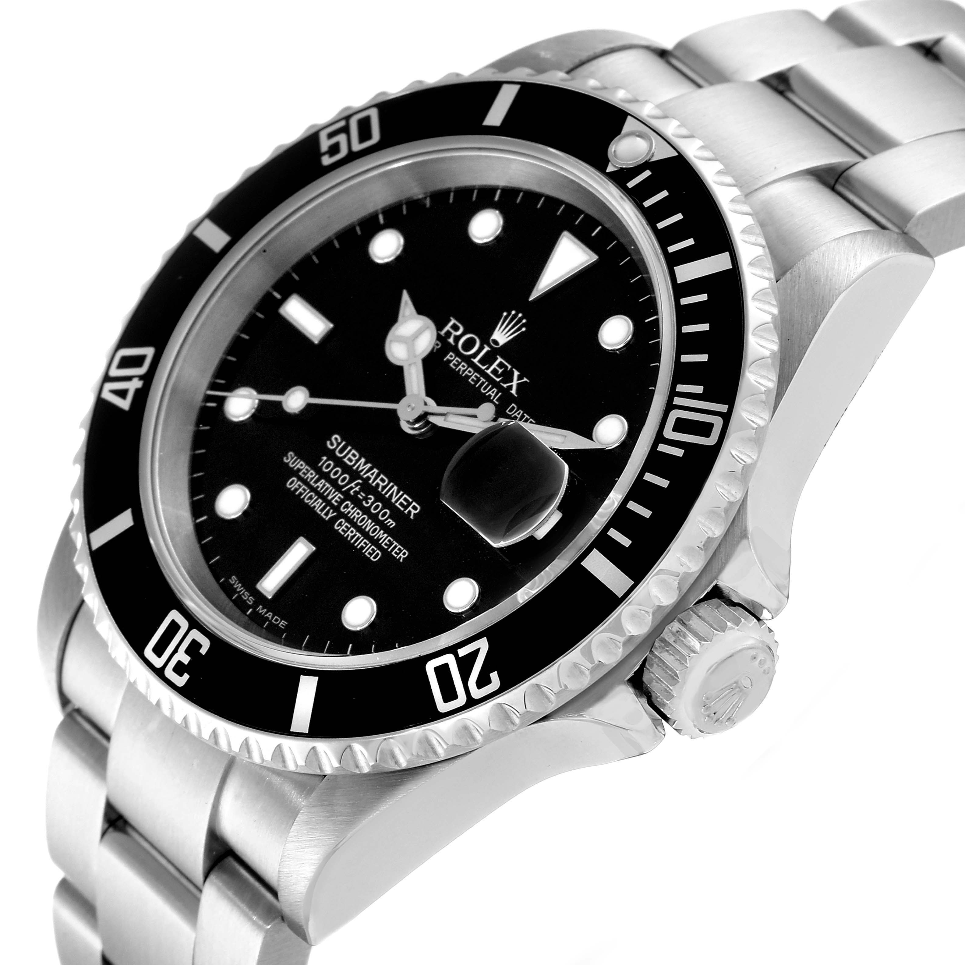 This angled shot of the Rolex Submariner 16610 Men's Stainless Steel Black Dial 16610 Men's Stainless Steel Black Dial watch shows the face, bezel, crown, and stainless steel bracelet.