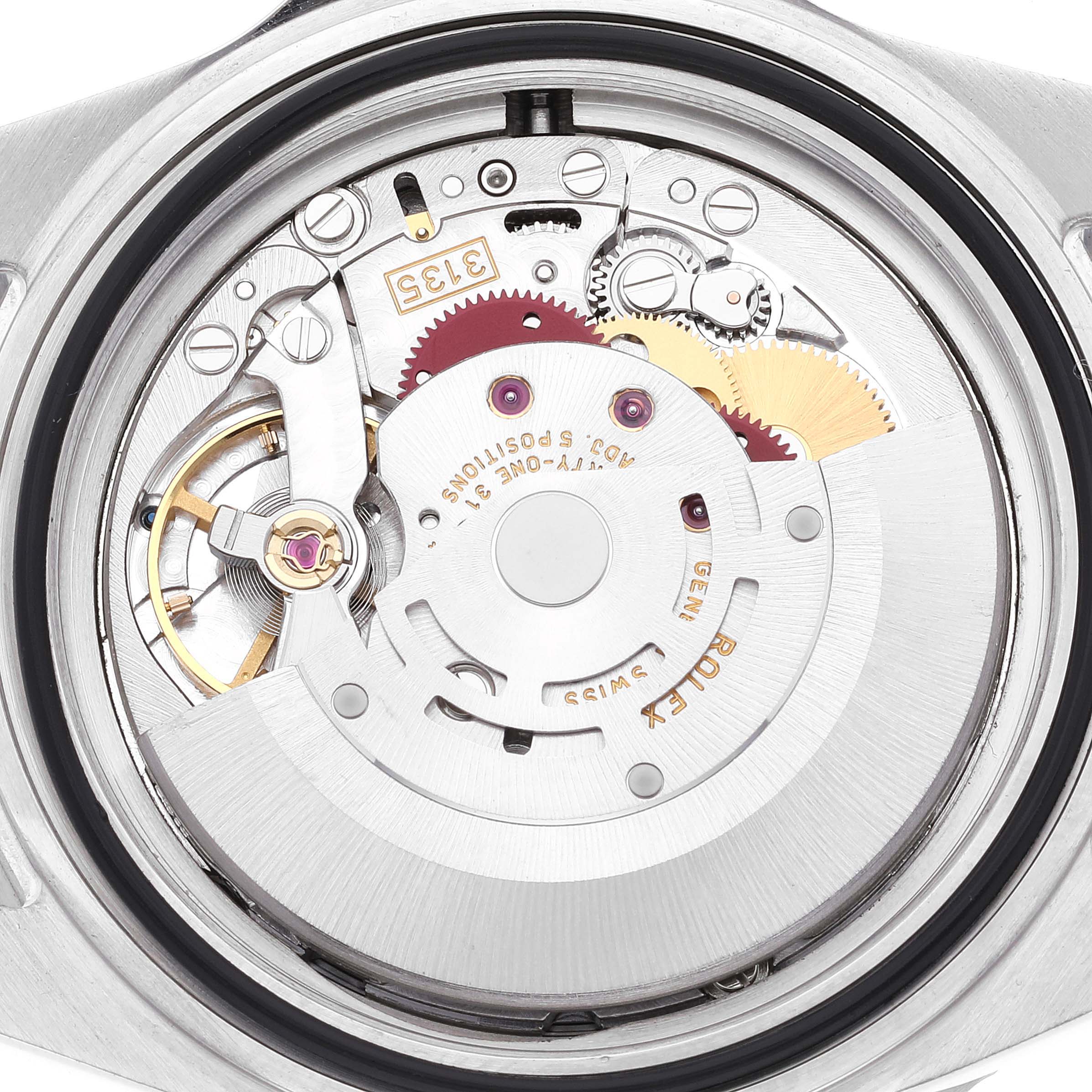 This image shows the inner mechanism, or movement, of a Rolex Submariner 16610 Men's Stainless Steel Black Dial 16610 Men's Stainless Steel Black Dial watch taken from a top-down angle.