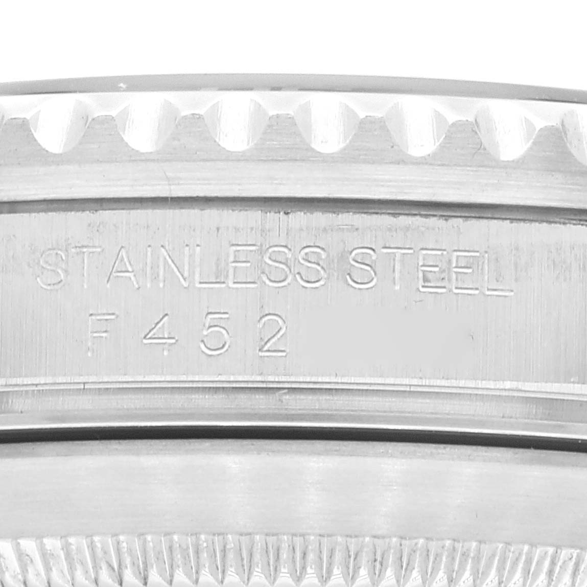 The image shows a close-up of the side of the case with engraving on a Rolex Submariner 16610 Men's Stainless Steel Black Dial 16610 Men's Stainless Steel Black Dial watch.