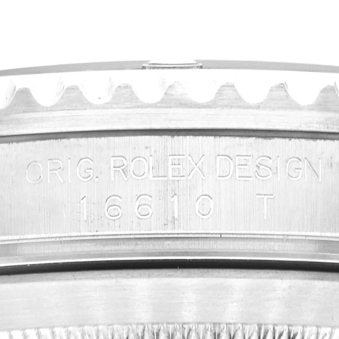 This image shows a close-up of the side of a Rolex Submariner 16610 Men's Stainless Steel Black Dial 16610 Men's Stainless Steel Black Dial watch case, displaying engraving details of its model number.