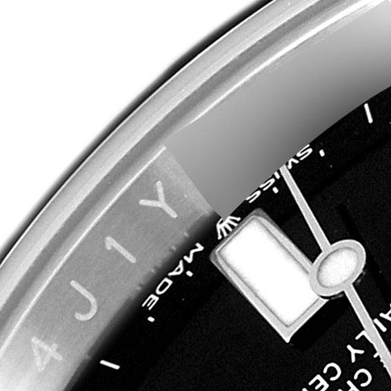 Close-up of the dial and part of the bezel of a Rolex Submariner 124060 Men
s Stainless Steel Black Dial 124060 Men
s Stainless Steel Black Dial watch, showing the "SWISS MADE" text and part of the luminescent marker.
