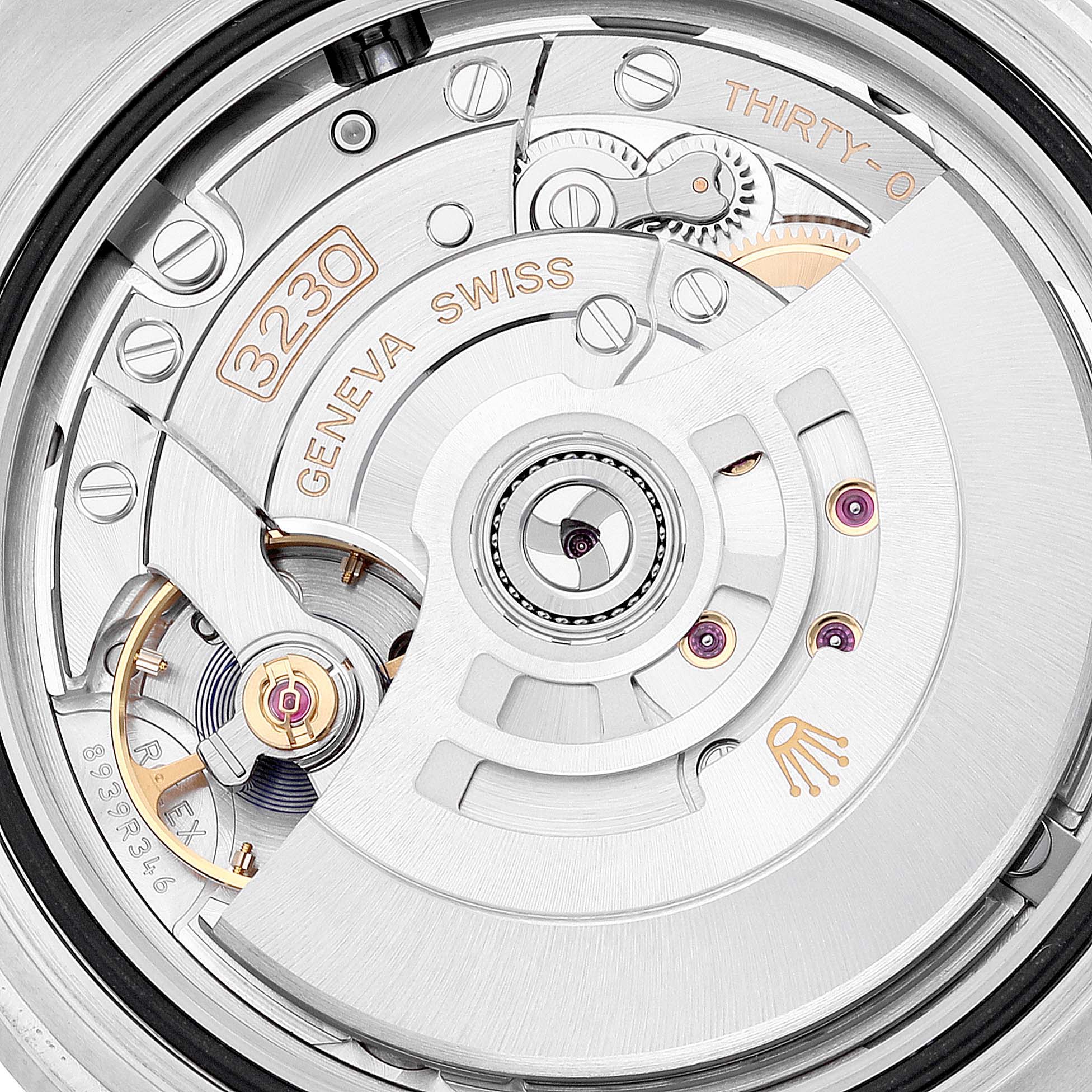 This image shows a close-up of the movement mechanism of a Rolex Submariner 124060 Men
s Stainless Steel Black Dial 124060 Men
s Stainless Steel Black Dial watch, featuring intricate components and engravings.