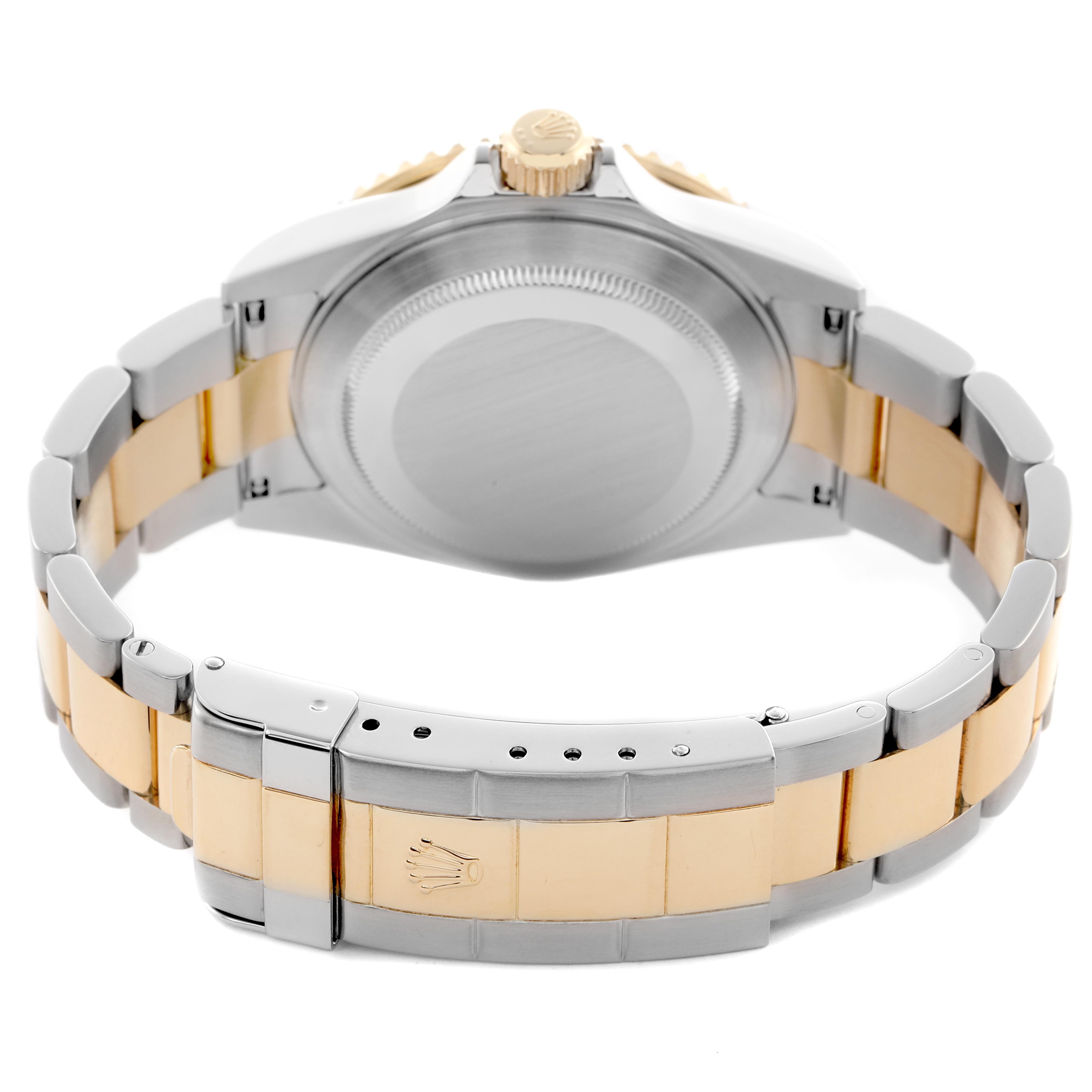 The image shows the back and bracelet of the Rolex Submariner 16613 Men
s Steel and Gold (two tone) Blue Dial 16613 Men
s Steel and Gold (two tone) Blue Dial, highlighting the clasp and case back.