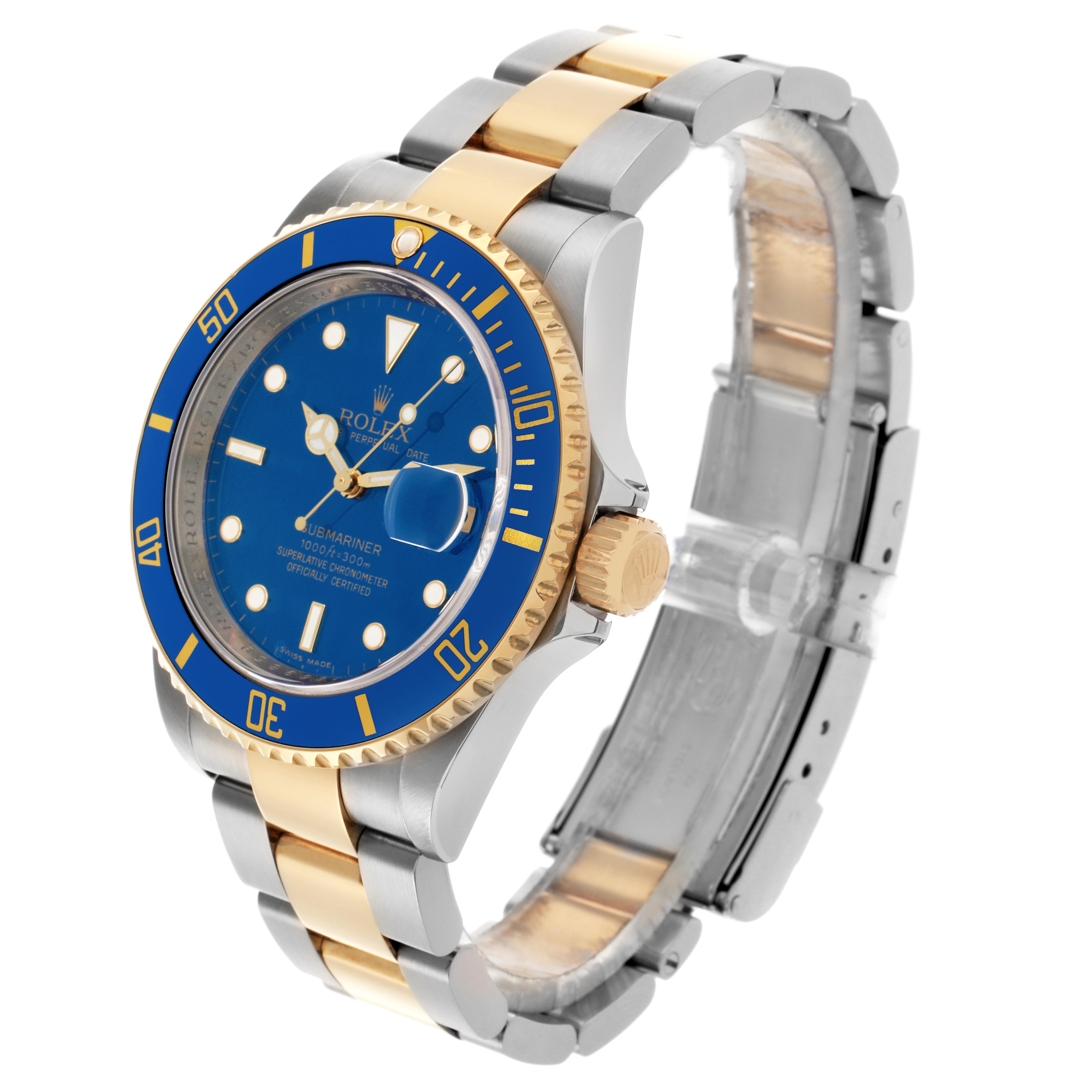 The Rolex Submariner 16613 Men
s Steel and Gold (two tone) Blue Dial 16613 Men
s Steel and Gold (two tone) Blue Dial watch is shown at a slight angle, revealing the dial, bezel, crown, and bracelet.