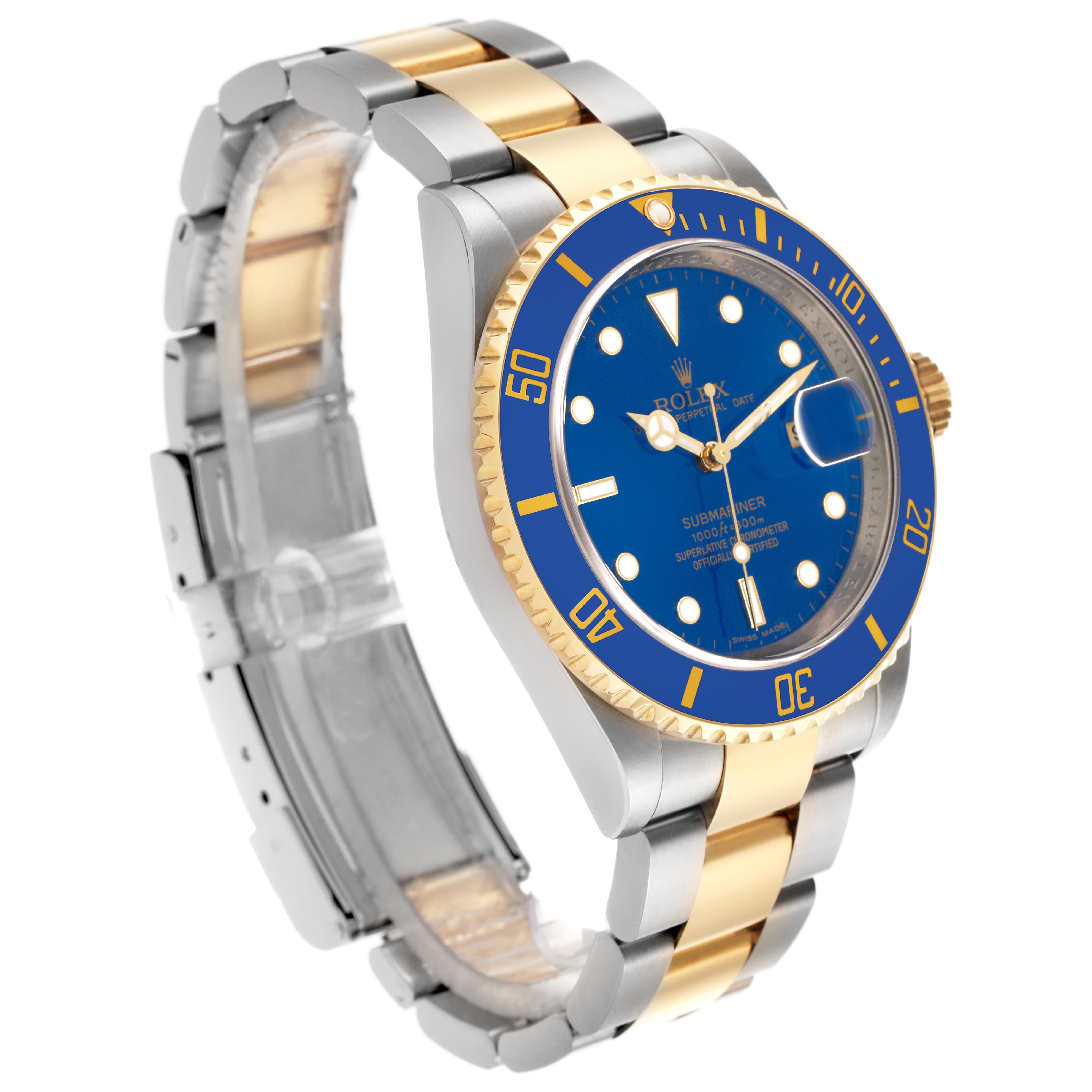 The Rolex Submariner 16613 Men
s Steel and Gold (two tone) Blue Dial 16613 Men
s Steel and Gold (two tone) Blue Dial is shown at a three-quarter angle, highlighting the blue dial, bezel, bracelet, and crown.