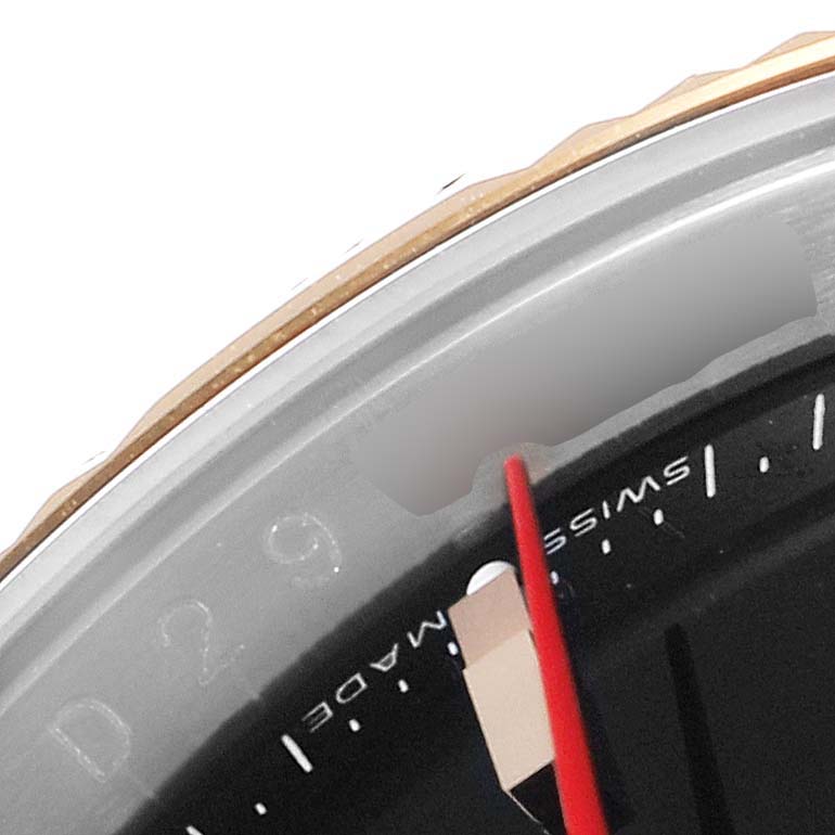 This close-up image shows a portion of the bezel and dial of the Rolex Turn-o-Graph 116261 Men's Steel and Gold (two tone) Black Dial 116261 Men's Steel and Gold (two tone) Black Dial watch.