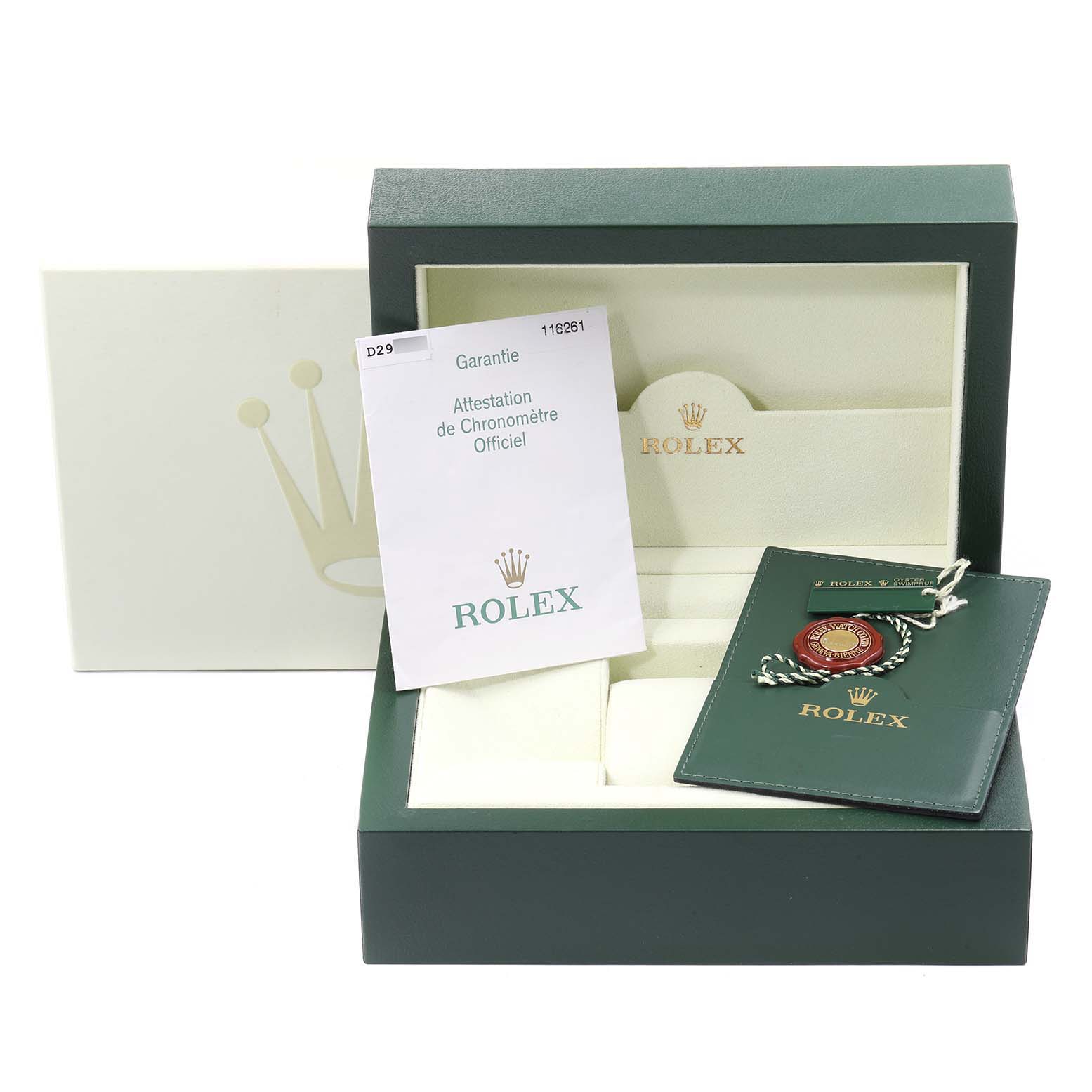 This image shows the packaging, warranty card, and accessories for the Rolex Turn-o-Graph 116261 Men's Steel and Gold (two tone) Black Dial 116261 Men's Steel and Gold (two tone) Black Dial model, with an open box angle.