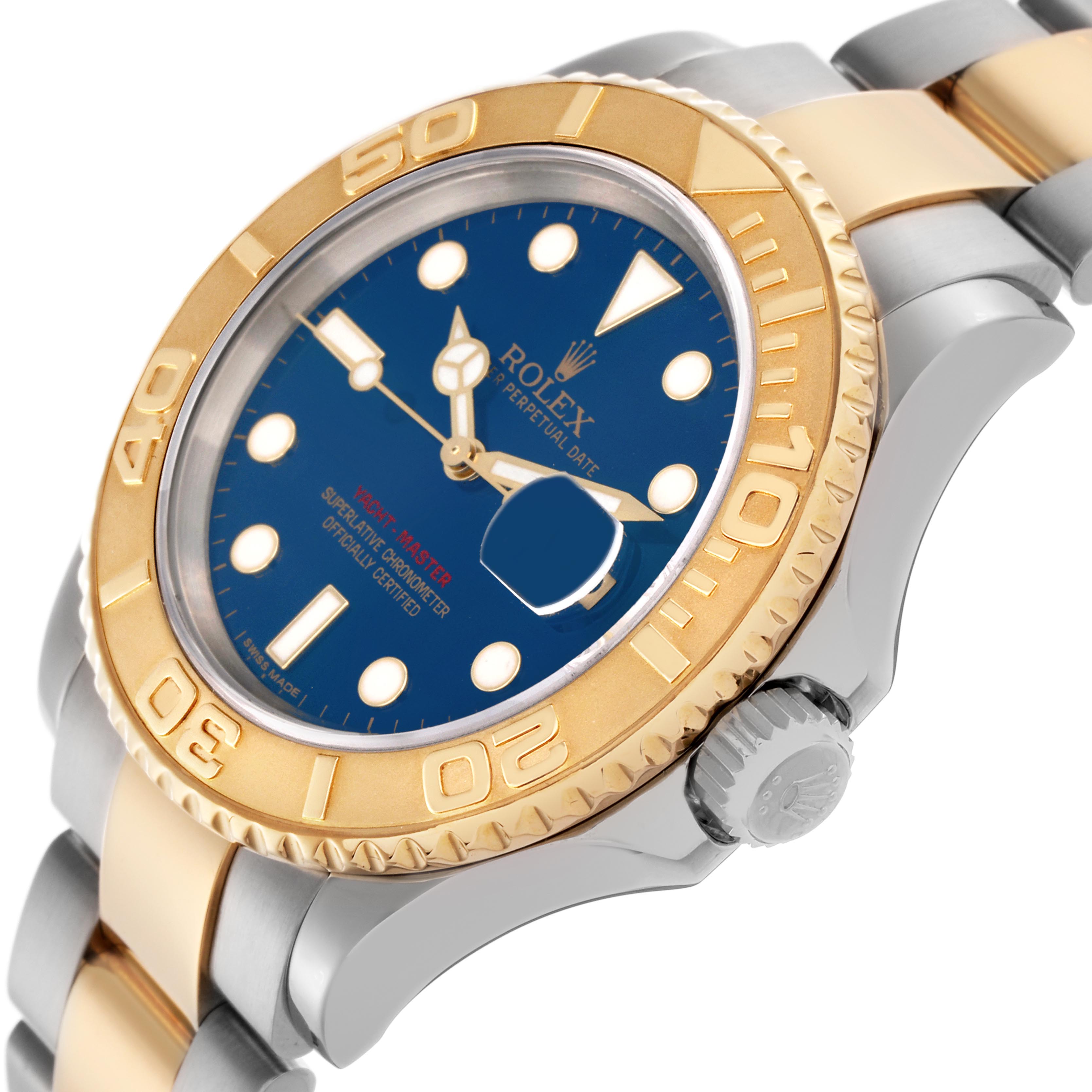 The Rolex Yacht-Master 16623 Men
s Steel and Gold (two tone) Blue Dial 16623 Men
s Steel and Gold (two tone) Blue Dial watch is shown at an angled view highlighting its bezel, dial, crown, and part of the bracelet.