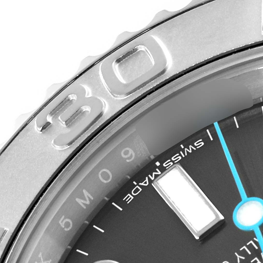 This close-up image of a Rolex Yacht-Master 116622 Men's Stainless Steel Grey Dial 116622 Men's Stainless Steel Grey Dial watch showcases part of the bezel with the "30" marking, part of the dial, and the "Swiss Made" label.