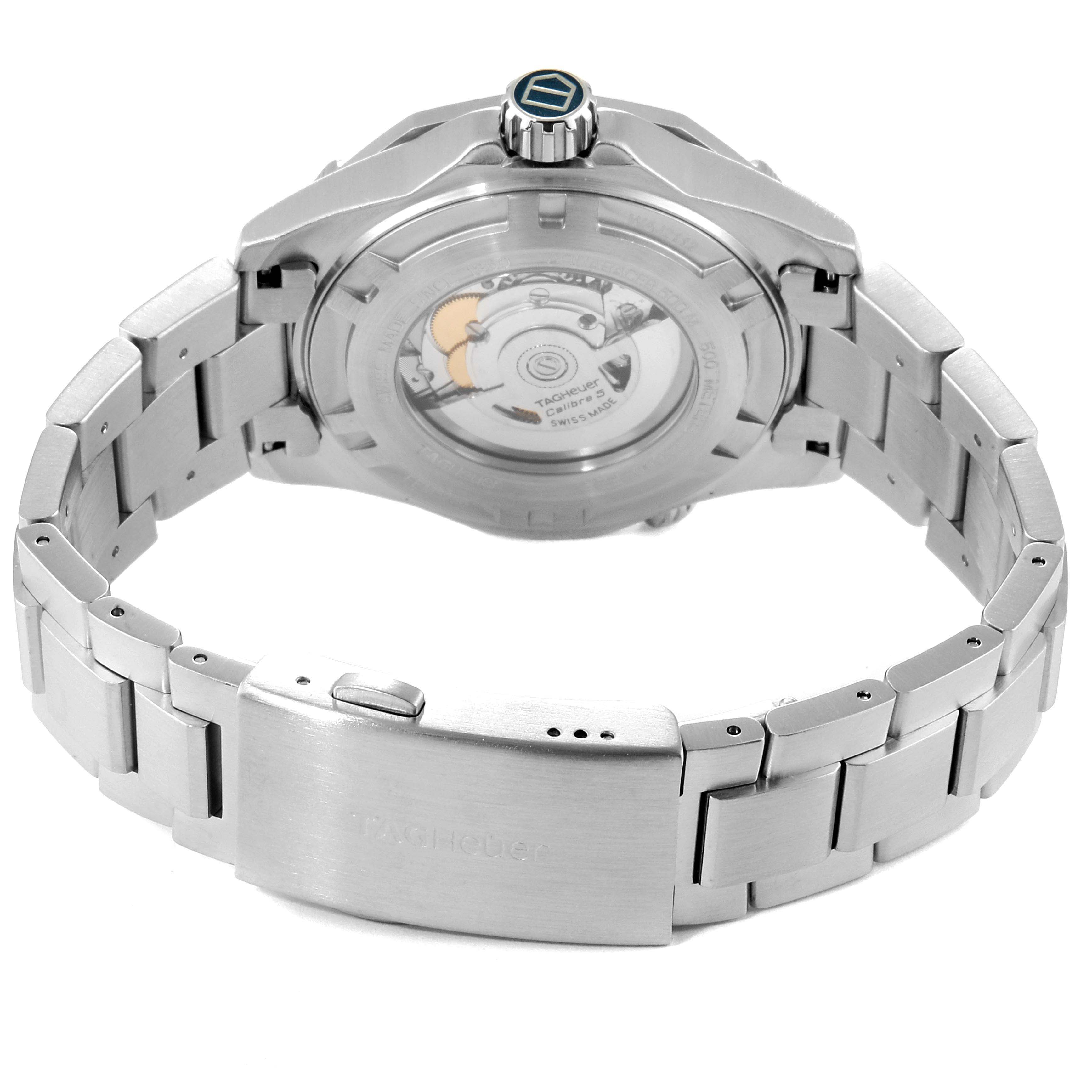 The image shows the back view of a Tag Heuer Aquaracer WAJ2112 Men's Stainless Steel Blue Dial WAJ2112 Men's Stainless Steel Blue Dial watch, highlighting its stainless steel bracelet and transparent case back.