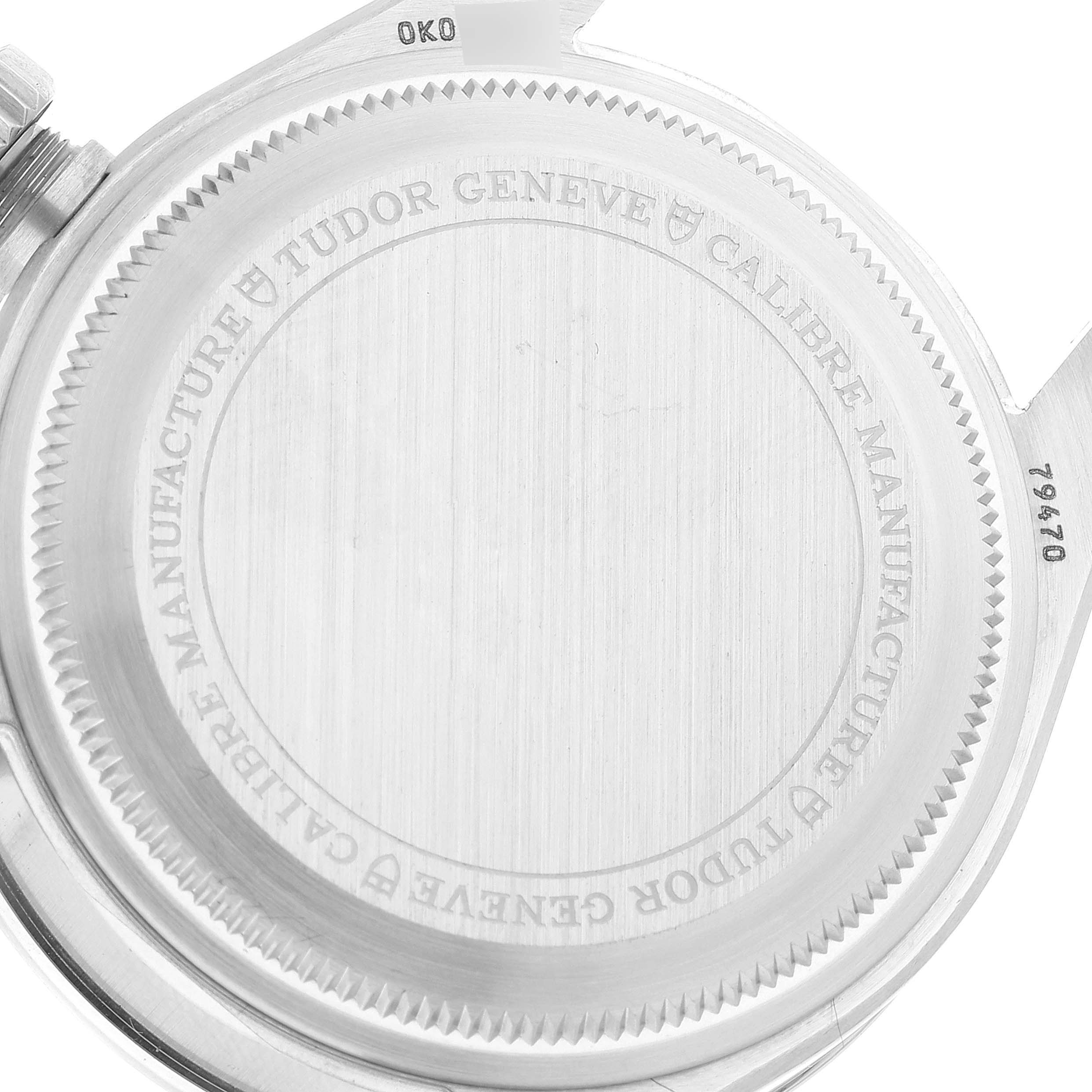 The image shows the rear case of a Tudor Heritage Black Bay M79470-0003 Men
s Stainless Steel Black Dial M79470-0003 Men
s Stainless Steel Black Dial watch, focusing on its engraved details.