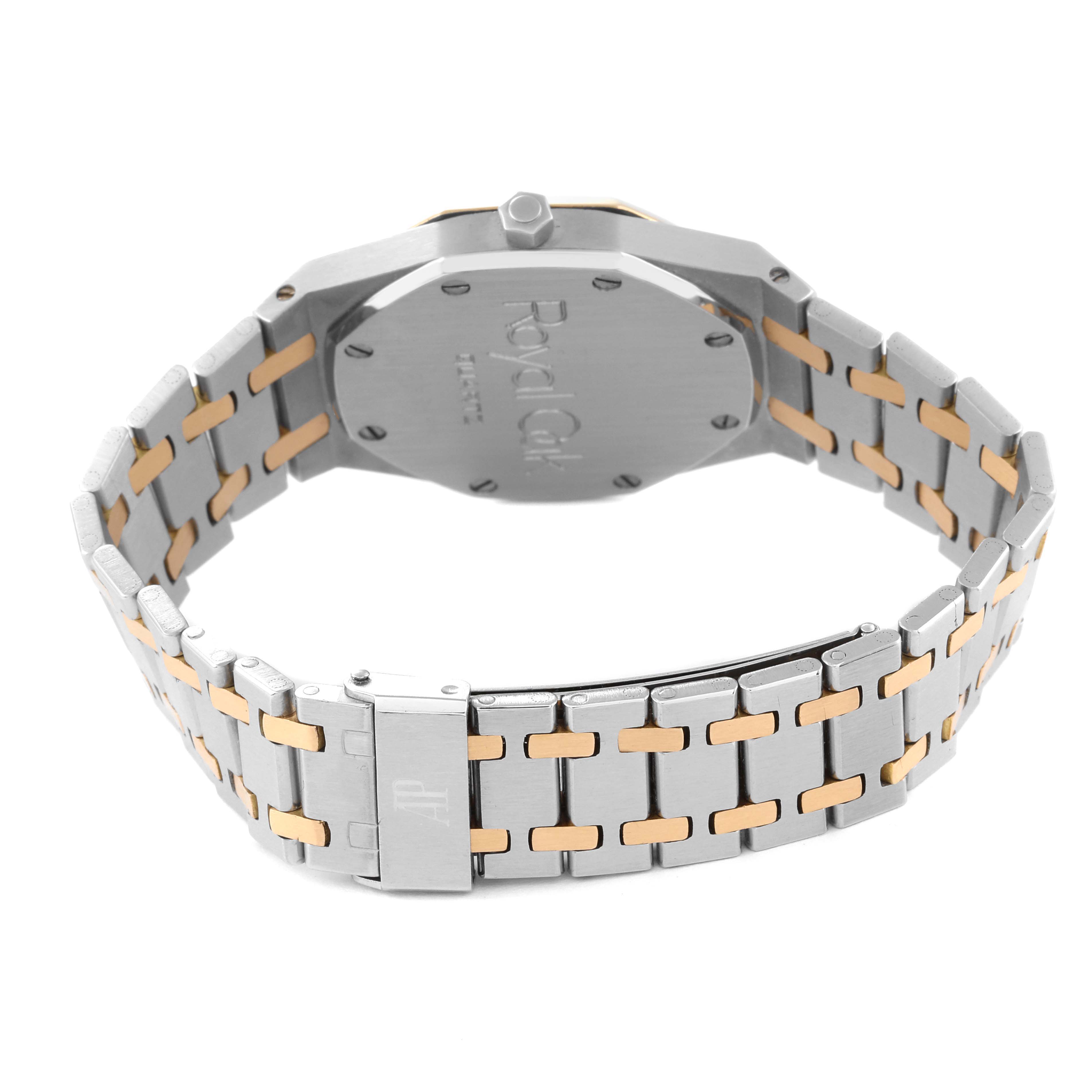 The image shows the back and bracelet of an Audemars Piguet Royal Oak 56023SA Men's Stainless Steel Grey Dial 56023SA Men's Stainless Steel Grey Dial watch, highlighting its two-tone metal design and clasp.