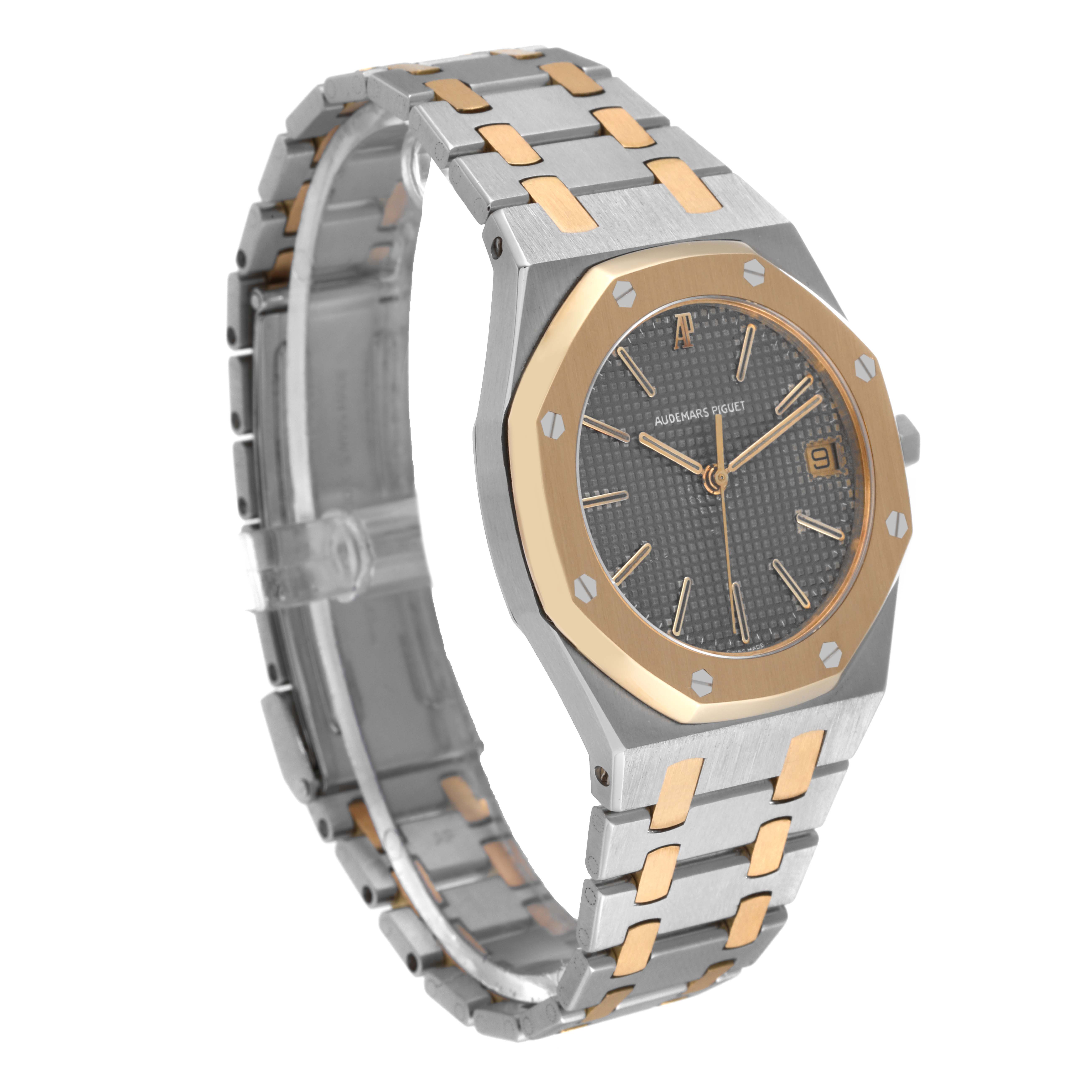 The image shows a side angle of the Audemars Piguet Royal Oak 56023SA Men's Stainless Steel Grey Dial 56023SA Men's Stainless Steel Grey Dial, displaying its bezel, dial, and bracelet clearly.