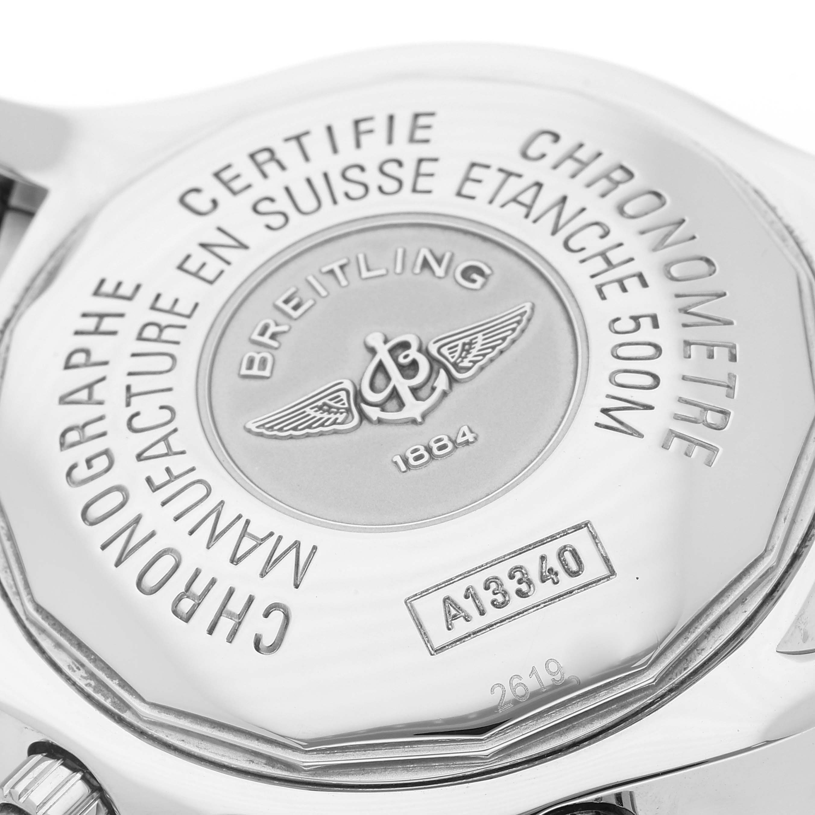 The image shows the back of a Breitling Superocean A13340 Men's Stainless Steel Beige Dial A13340 Men's Stainless Steel Beige Dial watch, highlighting its engravings and certification details.