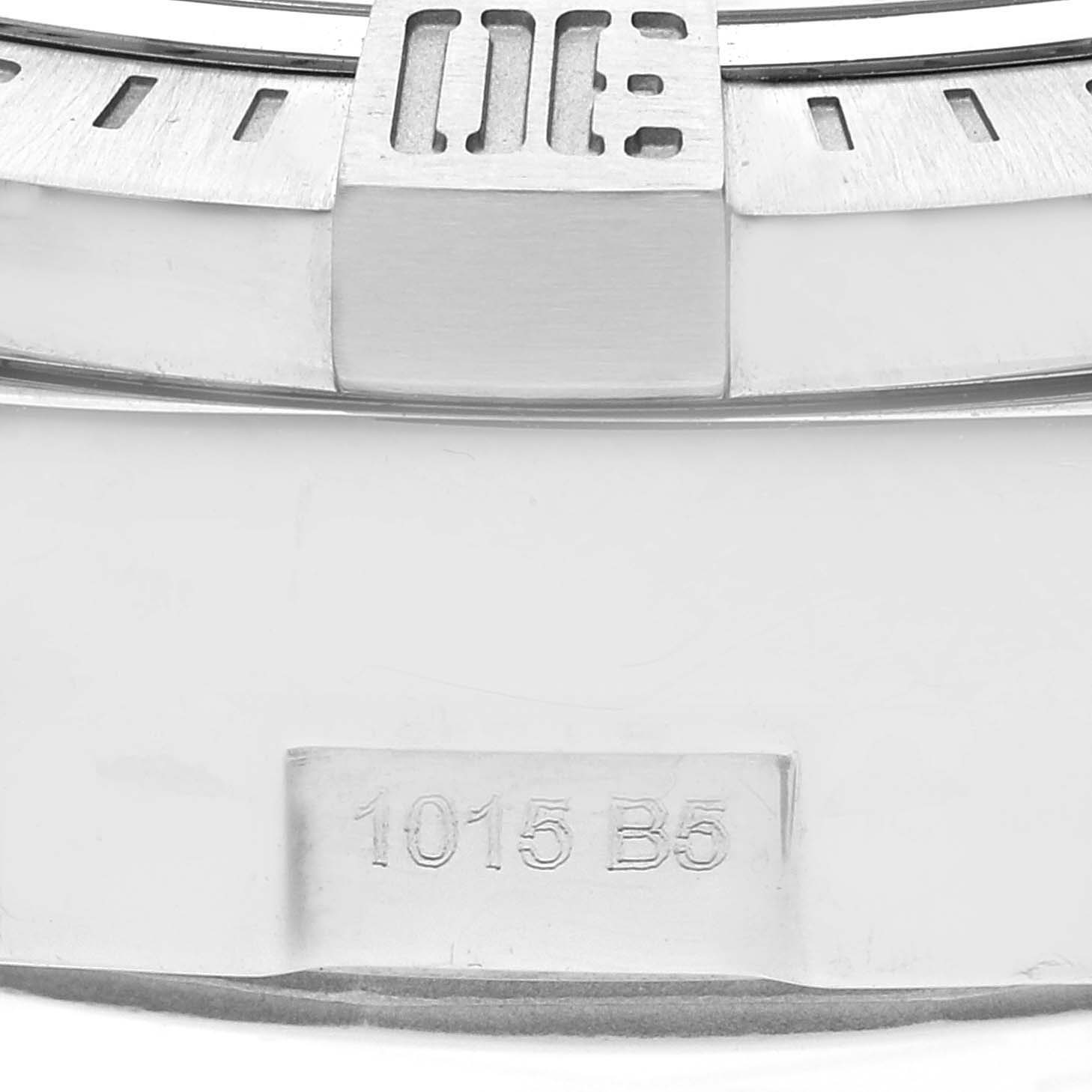This image shows a close-up angle of the bezel of a Breitling Avenger A13381 Men's Stainless Steel White Dial A13381 Men's Stainless Steel White Dial watch, revealing part of the engraved bezel and markings "1015 B5".