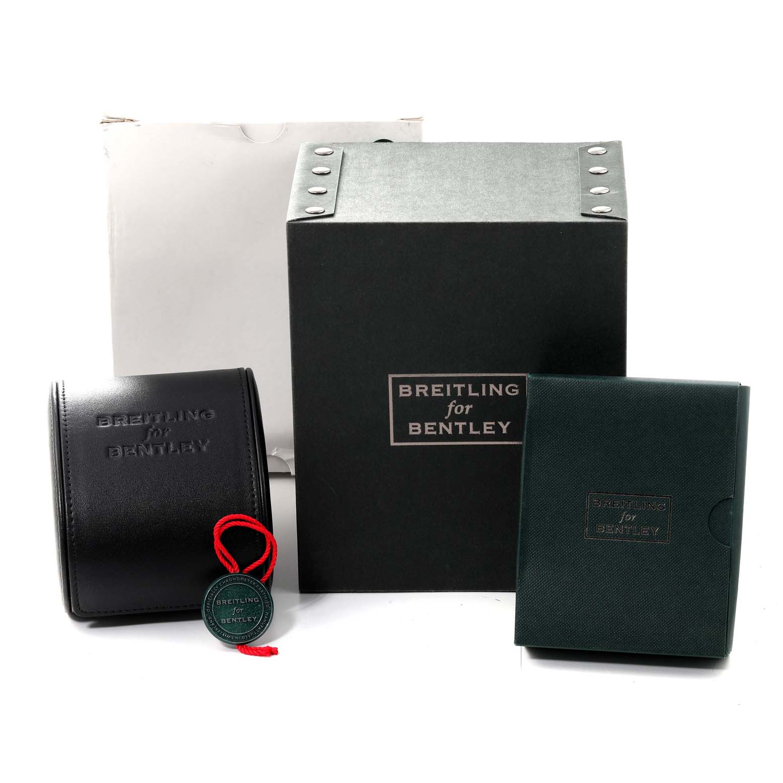 The image shows packaging and accessories for the Bentley model by Breitling, including boxes and a certificate pouch.