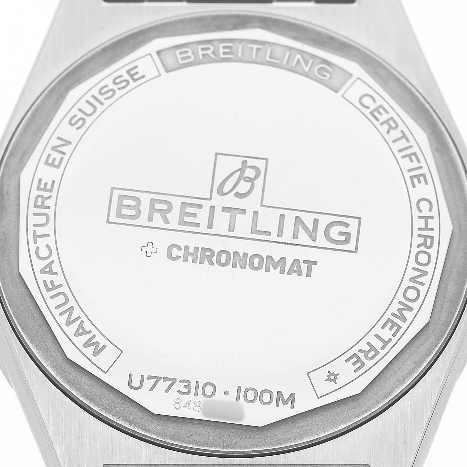 The image shows the back of the Breitling A77310591A1A1 Womens Steel and Gold (two tone) Silver Dial Chronomat 32 Steel Rose Gold Ladies Watch A77310, highlighting branding and specifications.
