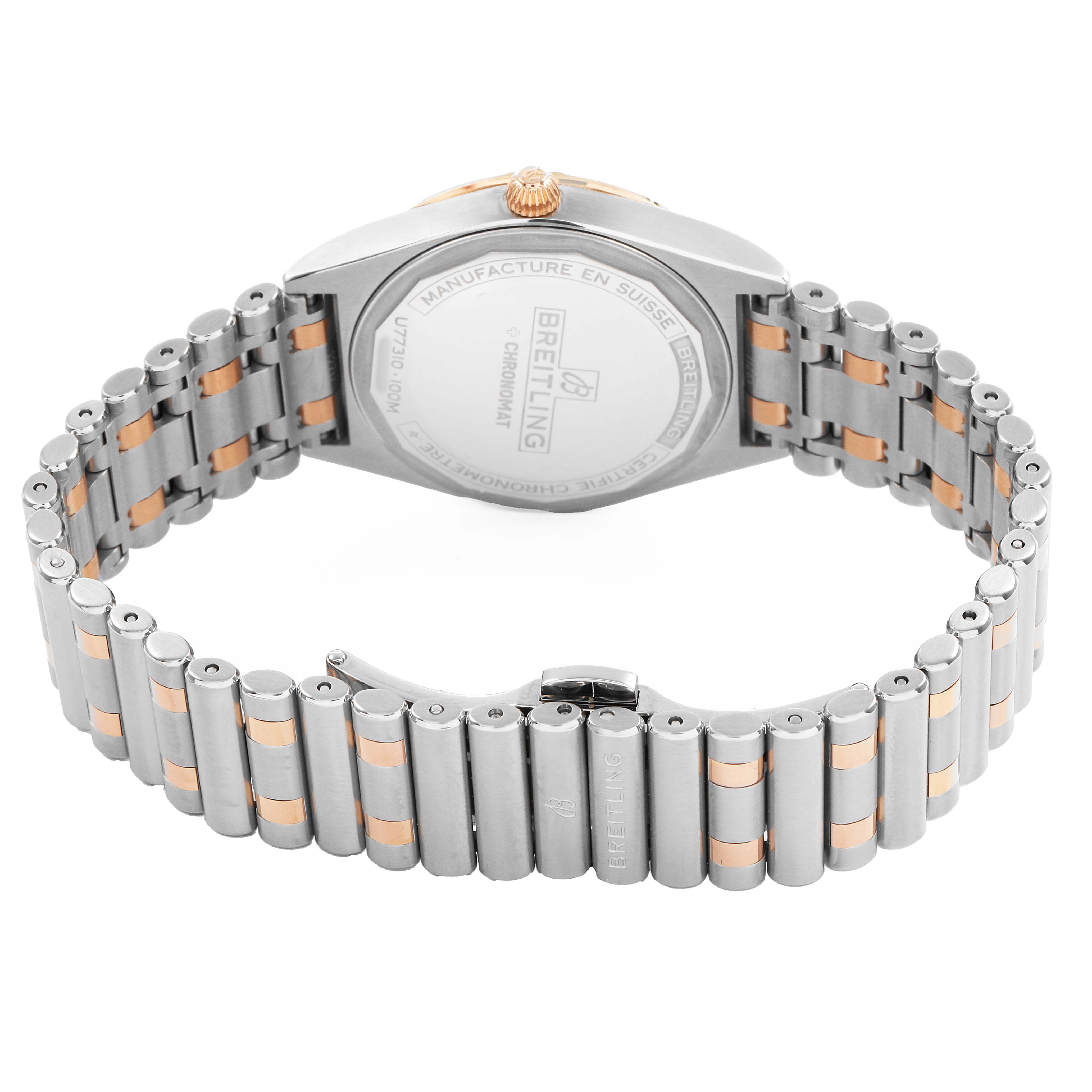 The Breitling A77310591A1A1 Womens Steel and Gold (two tone) Silver Dial Chronomat 32 Rose Gold watch is shown from the back, highlighting the caseback and bracelet.