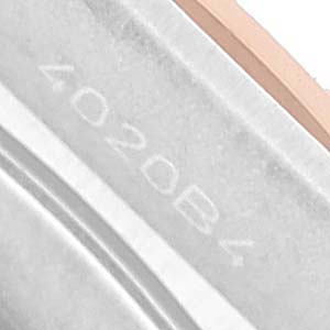 The image shows a close-up of the edge of the bezel and case of the Breitling A77310591A1A1 Womens Steel and Gold (two tone) Silver Dial Chronomat 32 Steel Rose Gold Ladies Watch A77310.