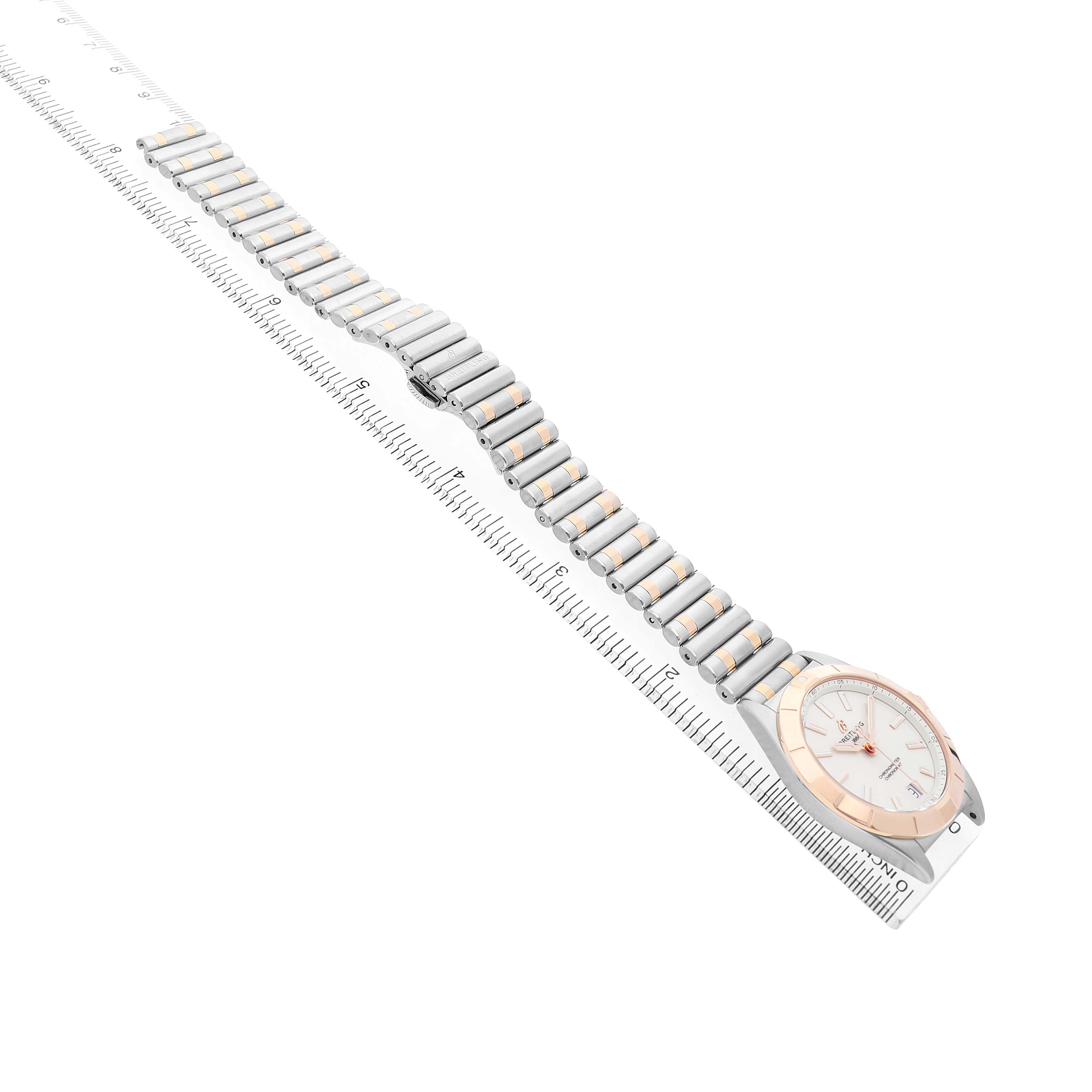The Breitling A77310591A1A1 Womens Steel and Gold (two tone) Silver Dial Chronomat 32 Steel Rose Gold Ladies Watch is shown from a diagonal top view, displaying the face and full bracelet.