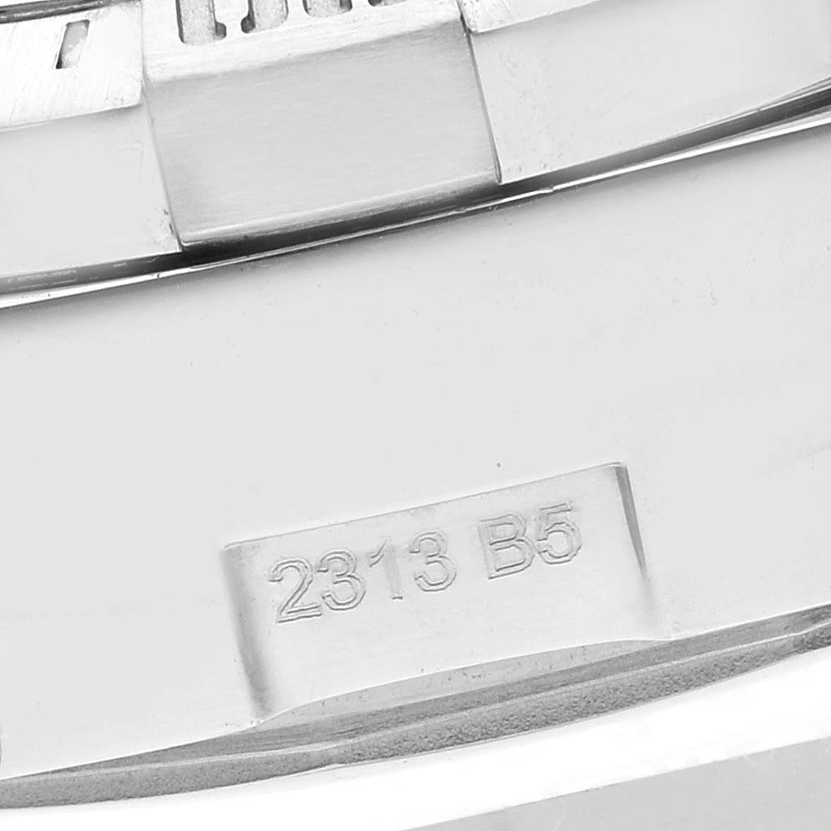 The image shows a close-up of the side case and serial number engraving of a Breitling Avenger A13381 Men's Stainless Steel Blue Dial A13381 Men's Stainless Steel Blue Dial watch.