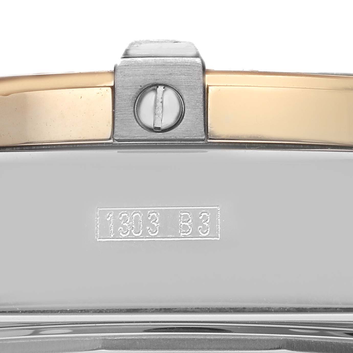 The image shows a close-up of the side of the Breitling Windrider D1335512 Men
s Steel and Gold (two tone) Black Dial D1335512 Men
s Steel and Gold (two tone) Black Dial watch, highlighting the clasp and engraved details.