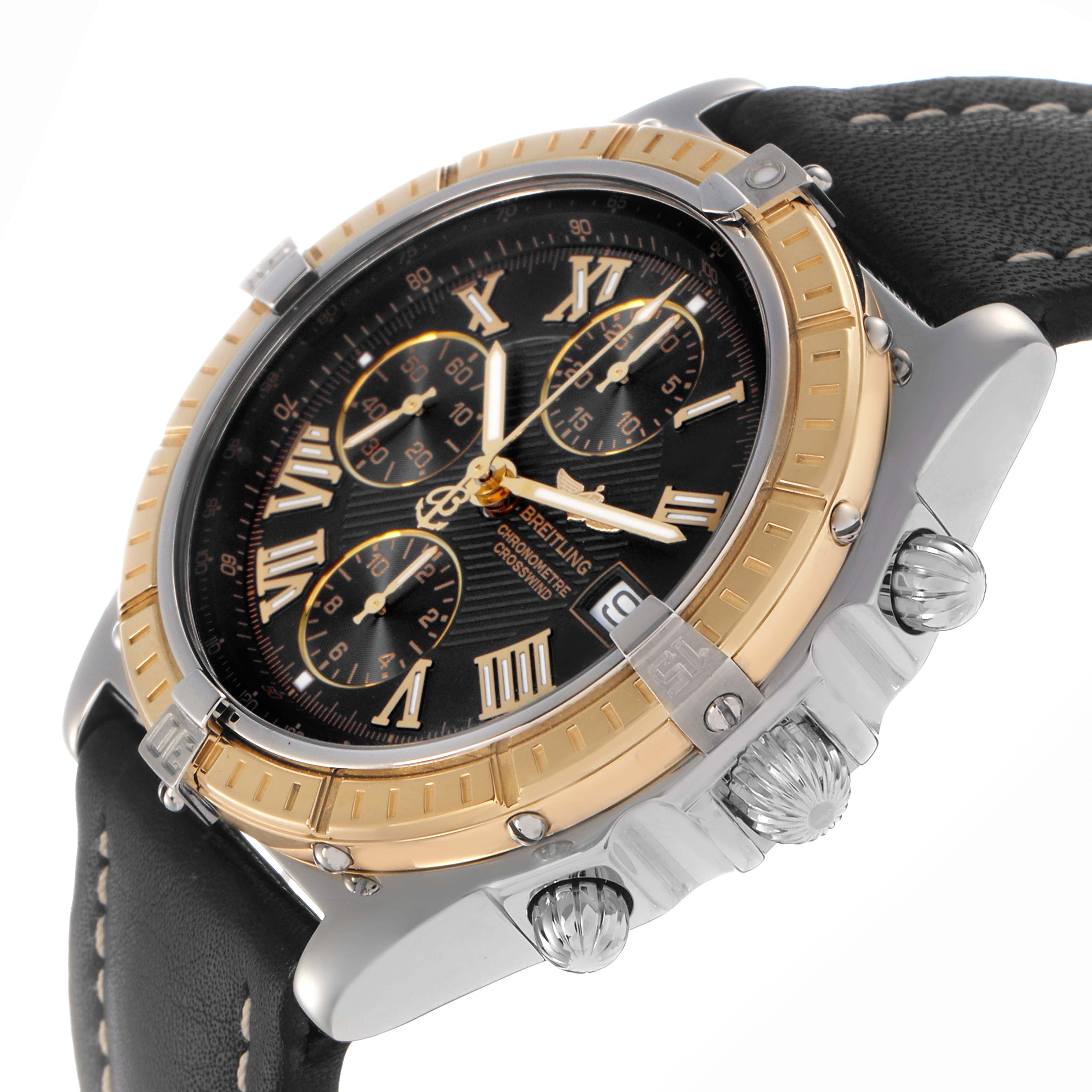 The Breitling Windrider D1335512 Men
s Steel and Gold (two tone) Black Dial D1335512 Men
s Steel and Gold (two tone) Black Dial watch is shown at an angled view focusing on the face, bezel, crown, and pushers, with a leather strap visible.