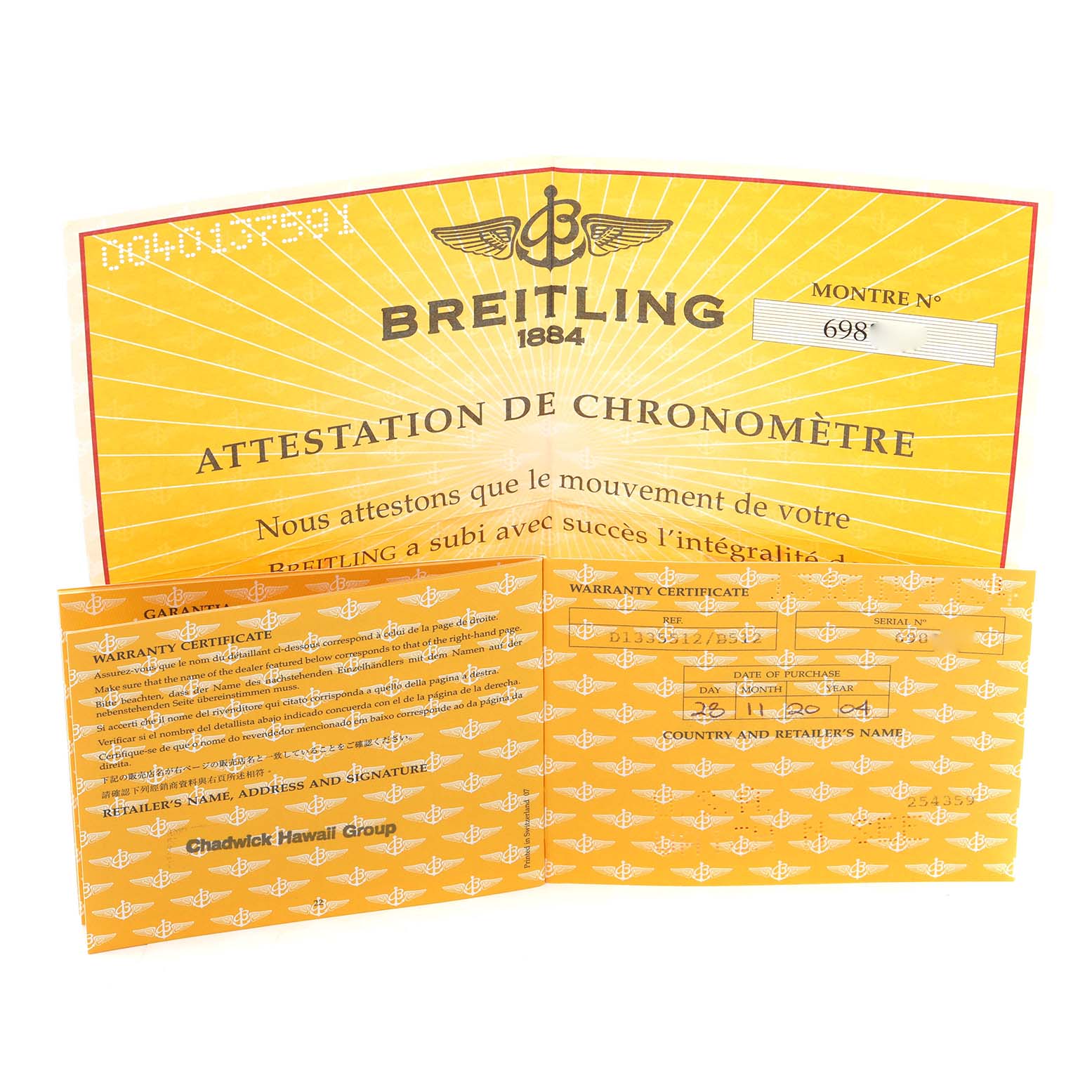 The image shows warranty certificates for the Breitling Windrider D1335512 Men
s Steel and Gold (two tone) Black Dial D1335512 Men
s Steel and Gold (two tone) Black Dial watch model.