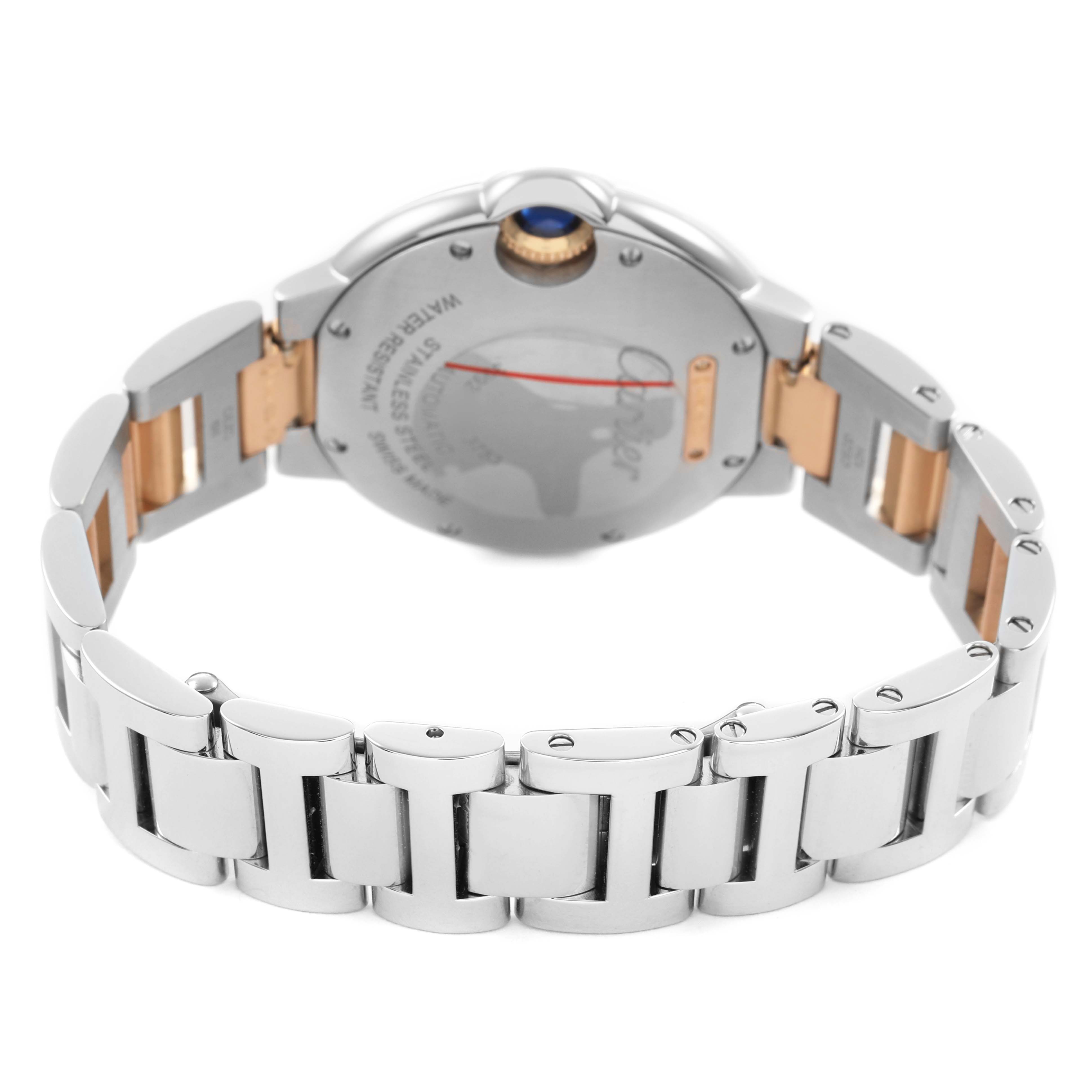 The image shows the back of a Cartier Ballon Bleu WE902077 Women's Steel and Gold (two tone) Silver Dial watch, highlighting its case, bracelet, and crown at an angled view.