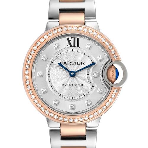 The Cartier Ballon Bleu WE902077 Women's Steel and Gold (two tone) Silver Dial watch is shown from a front angle, highlighting the dial, bezel with diamonds, and part of the bracelet.
