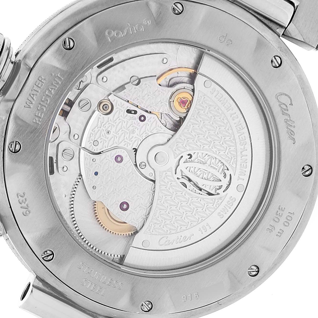 The image shows the back of a Cartier Pasha W31040H3 Men's Stainless Steel Silver Dial W31040H3 Men's Stainless Steel Silver Dial watch, revealing its mechanical movement and engraved details.