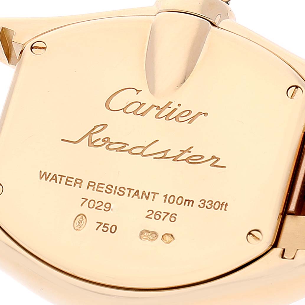 The image shows the back of a Cartier Roadster W62018V1 Women
s Yellow Gold Silver Dial W62018V1 Women
s Yellow Gold Silver Dial watch, displaying the brand, model, and water resistance details.