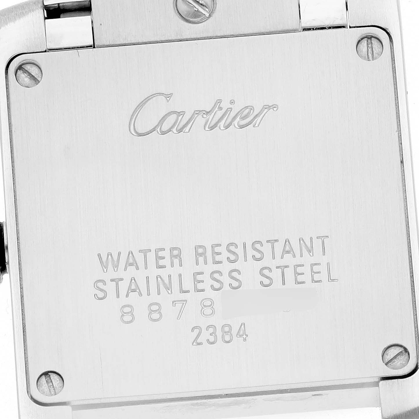 The image shows the back case of a Cartier Tank Francaise W51028Q3 Women
s Stainless Steel Mother of Pearl Dial W51028Q3 Women
s Stainless Steel Mother of Pearl Dial watch, highlighting the brand
s engraving and model details.